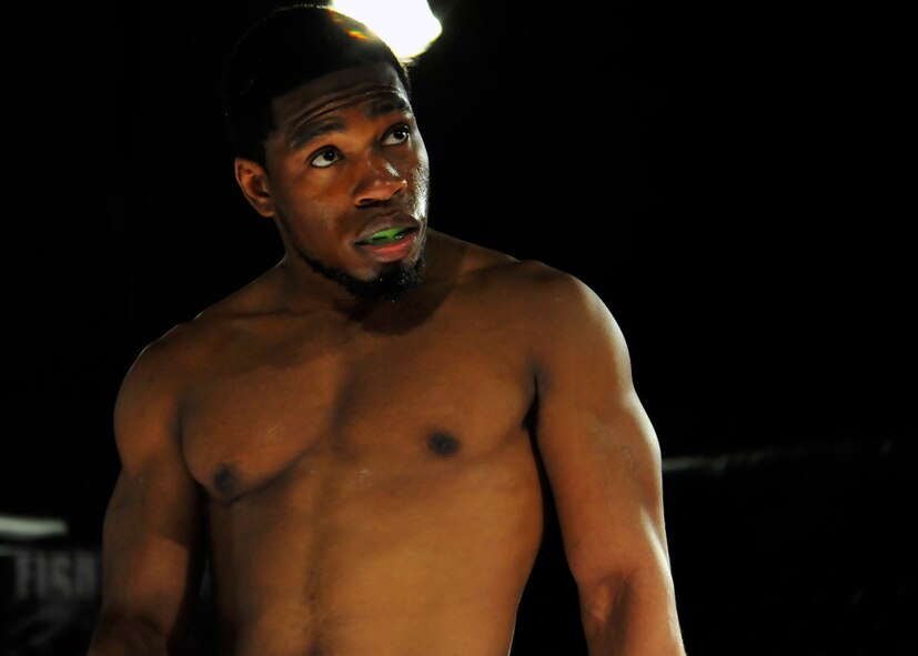 A mixed martial arts fighter stares down his opponent before his match begins at Shaw's fitness center, Shaw Air Force Base, S.C., March, 30, 2012. More than 900 Team Shaw members attended the MMA competition, making it the largest paid event to occur on the installation. (U.S. Air Force photo by Senior Airman Daniel Phelps/Released)