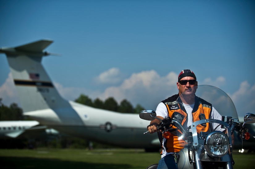 Robert Carman poses for a photo with his bike at Joint Base Charleston - Air Base April 2. The Green Knights Military Motorcycle Club is a non-profit organization for military and Department of Defense motorcyclists and has more than 100 chapters all over the world. Carman is a retired U.S. Air Force master sergeant and is the Green Knights Motorcycle Club vice president. (U.S. Air Force photo by Airman 1st Class George Goslin)