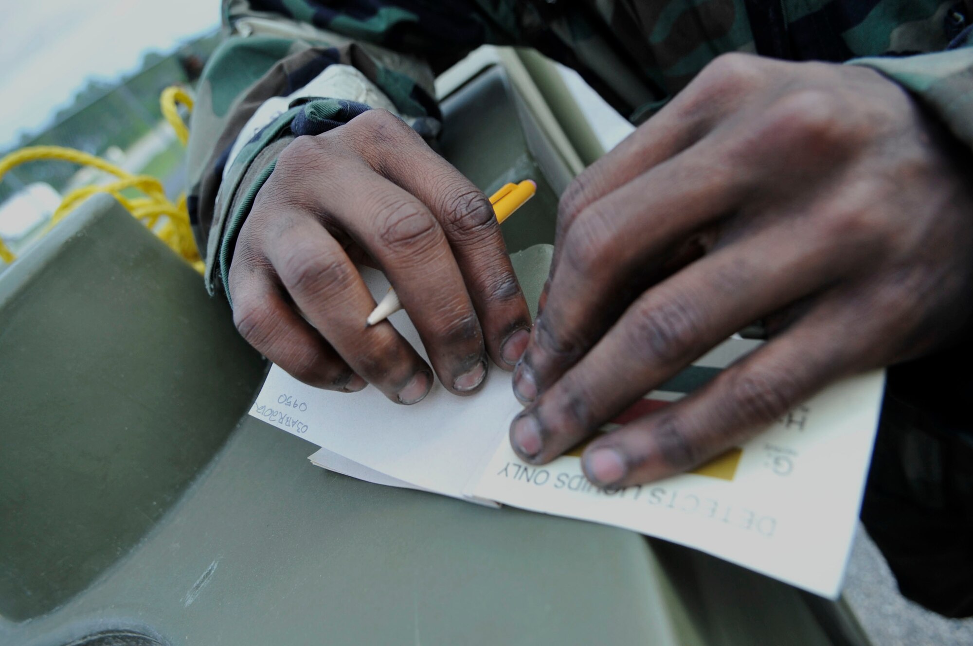 U.S. Air Force Airman 1st class Dakota Brown, 20th Aircraft Maintenance Squadron weapons crew member, marks M9 paper during an unexploded ordnance recognition drill, Shaw Air Force Base, S.C., April 3, 2012. Dakota, along with other Airmen, were preparing for their upcoming deployments.(U.S. Air Force photo by Airman Nicole Sikorski/Released)