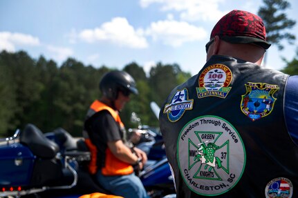 Chief Petty Officer Richard Butler displays his "colors" while sitting on his motorcycle at Joint Base Charleston - Air Base April 2. The Green Knights Military Motorcycle Club is a non-profit organization for military and Department of Defense motorcyclists and has more than 100 chapters all over the world. Butler is a machinist mate assigned to the Nuclear Power Training Unit and is the road captain for the Green Knights. (U.S. Air Force photo by Airman 1st Class George Goslin)
