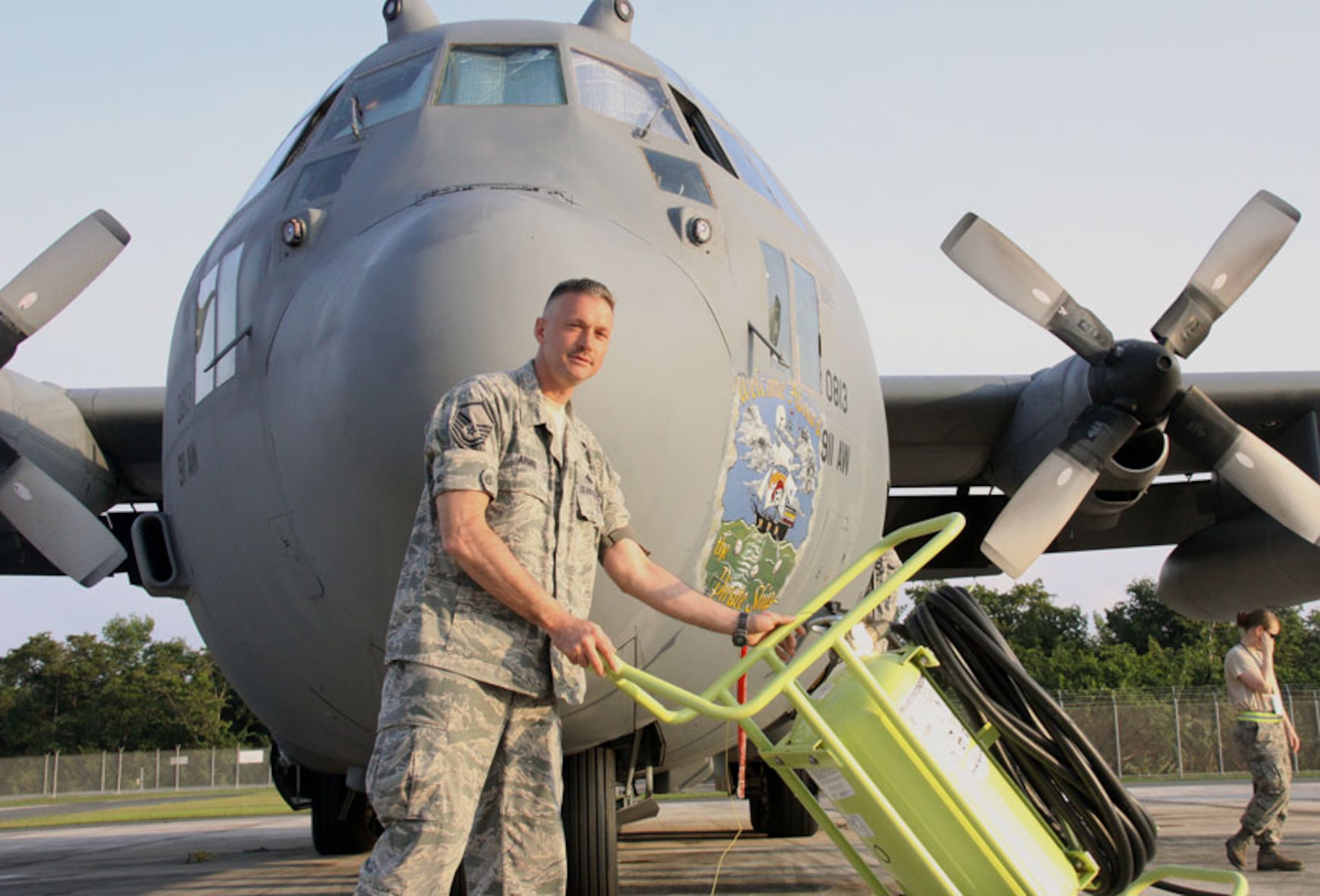 Master Sgt. Val Armel, 'Coronet Oak' maintenance expediter, positions a 150-pound halon fire bottle on the Muniz Air National Guard Base, Puerto Rico on April 4, 2012.  The halon bottle must be prepositioned as a precautionary measure prior to performing any maintenance on an aircraft.  911th Airlift Wing maintainers are currently deployed to Puerto Rico in support of Air Expeditionary Force 'Coronet Oak' operations. (U.S. Air Force photo by Capt. Shawn M. Walleck/Released)


