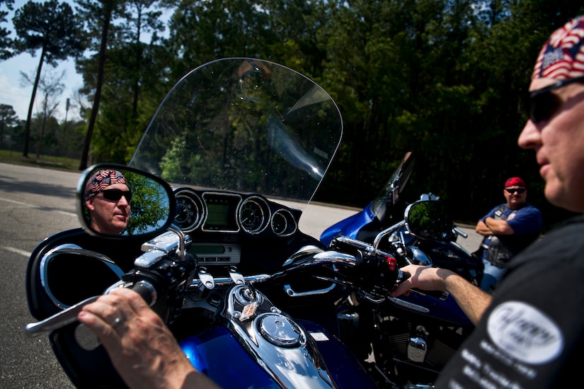 Petty Officer 1st Class Scott Rothfusz sits on his motorcycle at Joint Base Charleston - Air Base April 2. The Green Knights Military Motorcycle Club is a non-profit organization for military and Department of Defense motorcyclists and has more than 100 chapters all over the world. Petty Officer Rothfusz is an electronics technician assigned to the Nuclear Power Training Unit and is the Green Knights Treasurer and Ride Director. (U.S. Air Force photo by Airman 1st Class George Goslin)