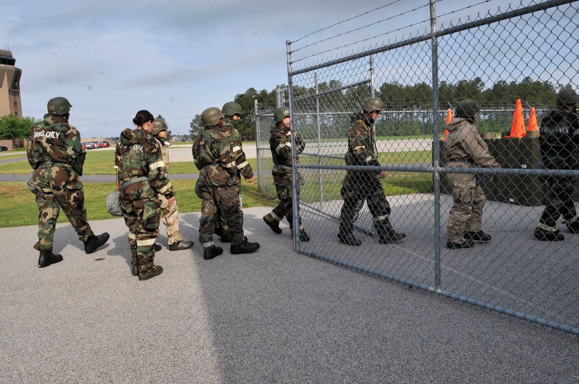 U.S. Air Force Airmen enter the chemical, biological, radiological, nuclear, and explosives training area at Shaw Air Force Base, S.C., April 3, 2012.  These Airmen were preparing for the interactive portion of this class, which prepares them for their upcoming deployment.(U.S. Air Force photo by Airman Nicole Sikorski/Released)