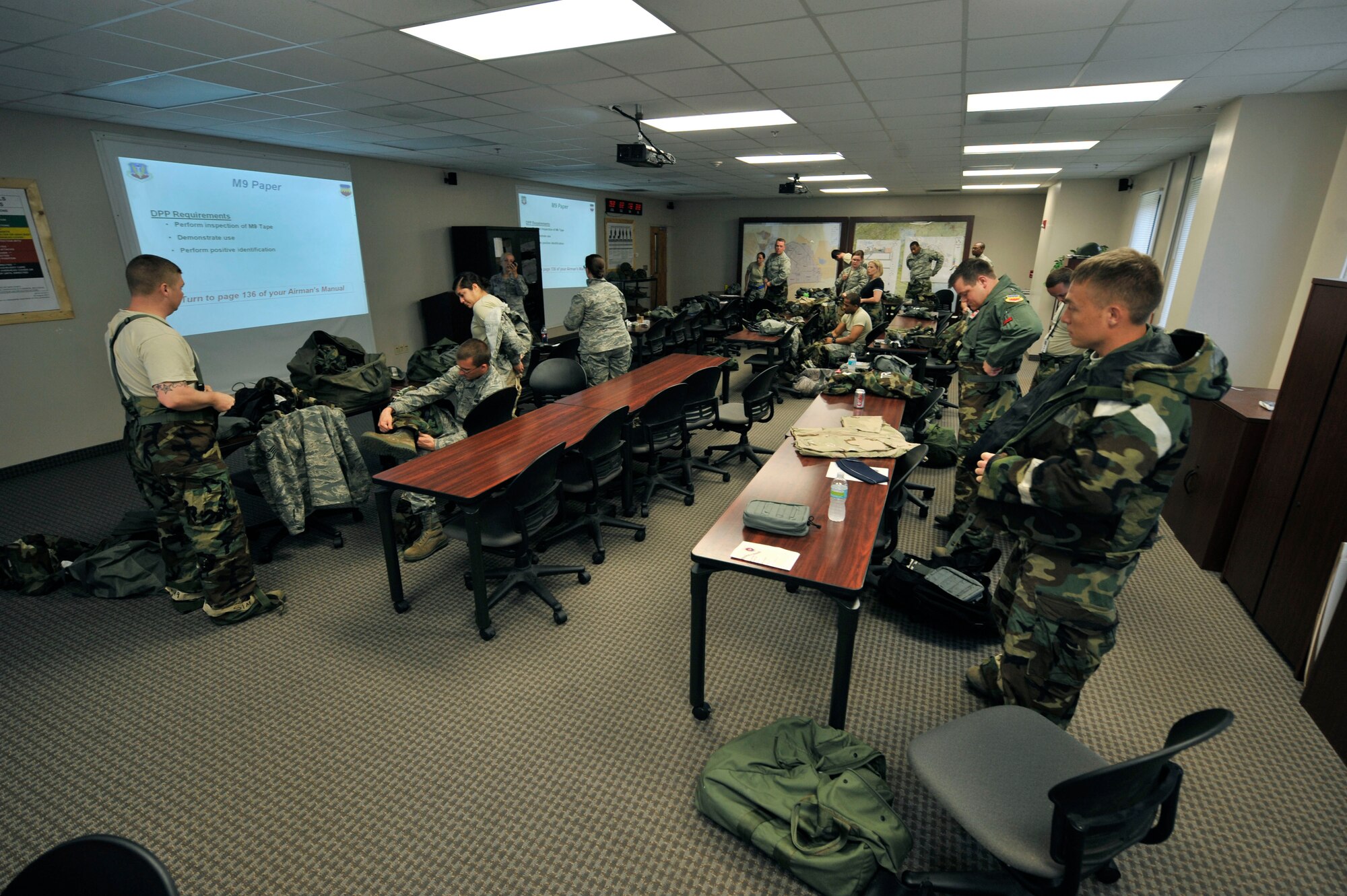 U.S. Air Force Airmen fisnish the class room portion of chemical, biological, radiological, nuclear and explosive(CBRNE) training in preperation for deployment, Shaw Air Force Base, S.C., April 3, 2012. After class room instruction, the Airmen participated in a hands on portion of the course to apply what their skills.(U.S. Air Force photo by Airman Nicole Sikorski/Released)