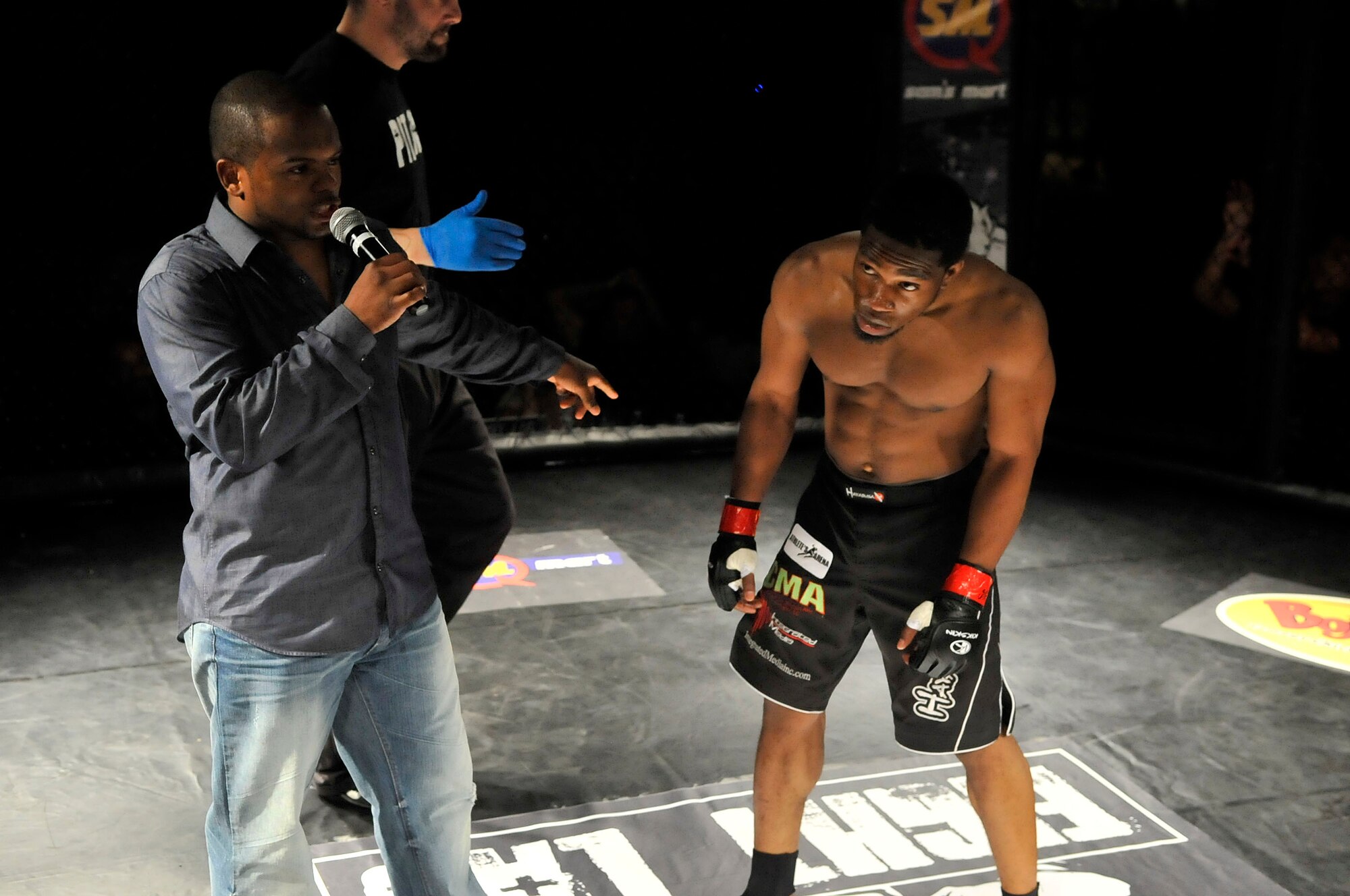 Solon Staley stares down his opponent at Fight Lab's Mixed Martial Arts cage fight, Shaw Air Force Base, S.C., March 30, 2012.  Staley attained the title against Mike Powell.(U.S. Air Force photo by Airman Nicole Sikorski/Released)