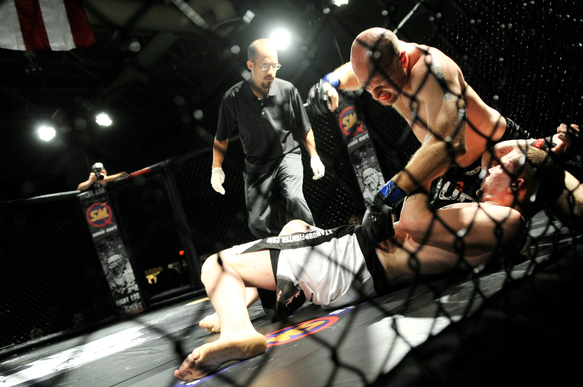 Josh Porter and Josh Claudio fight during Fight Lab’s  Mixed Martial Arts event, Shaw Air Force Base, S.C., March 30, 2012.  More than 900 people attended this first time event at Shaw.(U.S. Air Force photo by Airman Nicole Sikorski/Released)