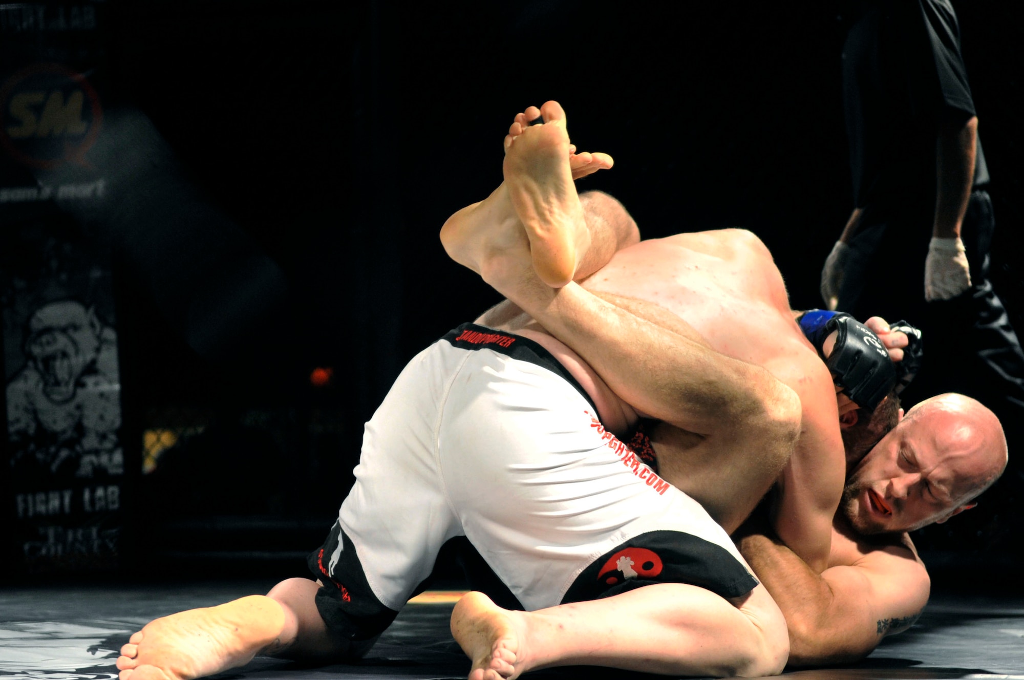 Dakota Hill and Brian Jones compete during Fight Lab’s  Mixed Martial Arts event, Shaw Air Force Base, S.C., March 30, 2012.  More than 900 people attended this first time event at Shaw.(U.S. Air Force photo by Airman Nicole Sikorski/Released)