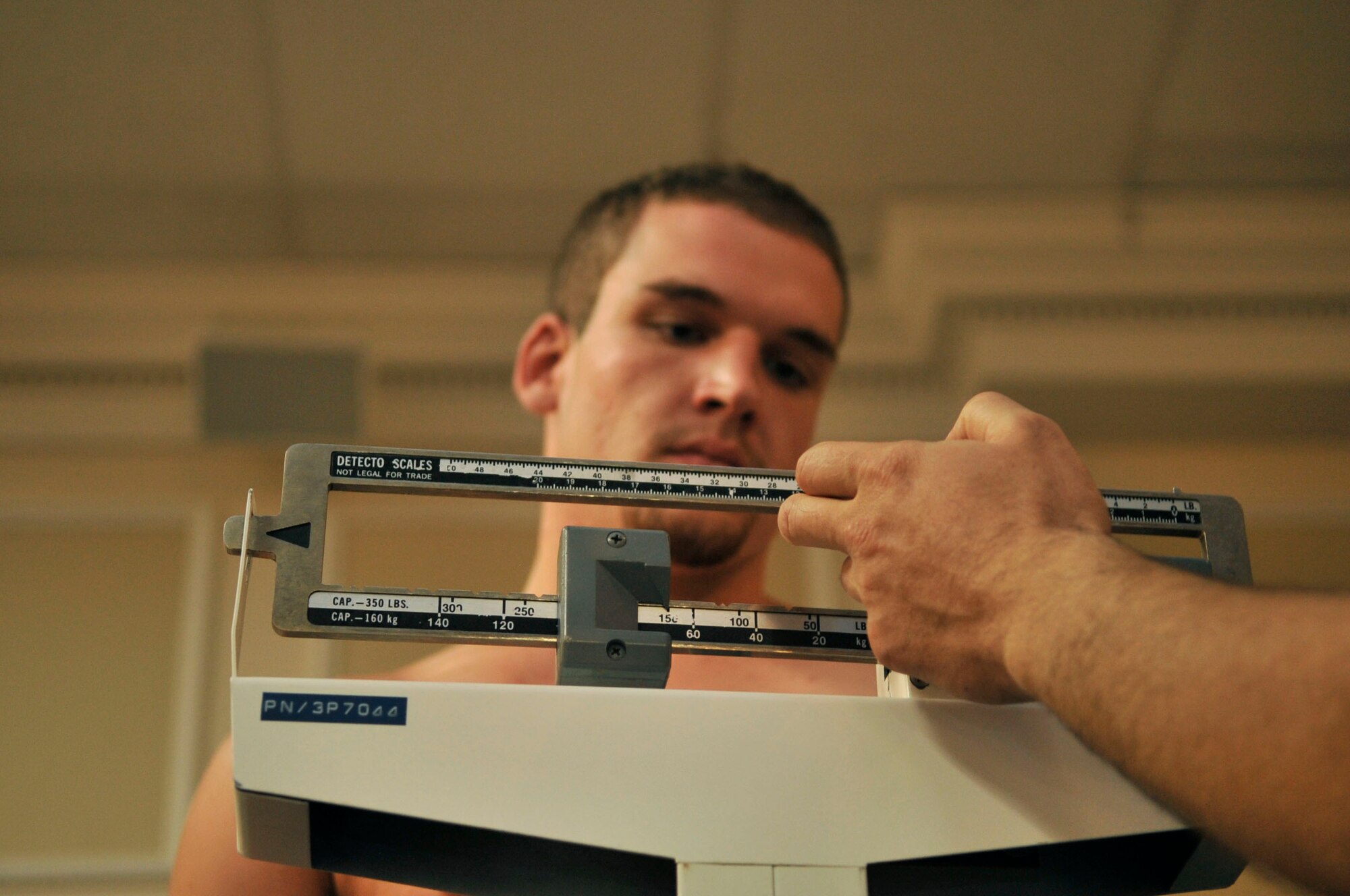 Dakota Hill weighs in at 170 lbs. at Carolina Skies Club, Shaw Air Force Base, S.C., March 30, 2012.  Hill was weighing in for his Mixed Martial Arts cage fight later that night against Brian Jones.(U.S. Air Force photo by Airman Nicole Sikorski/Released)