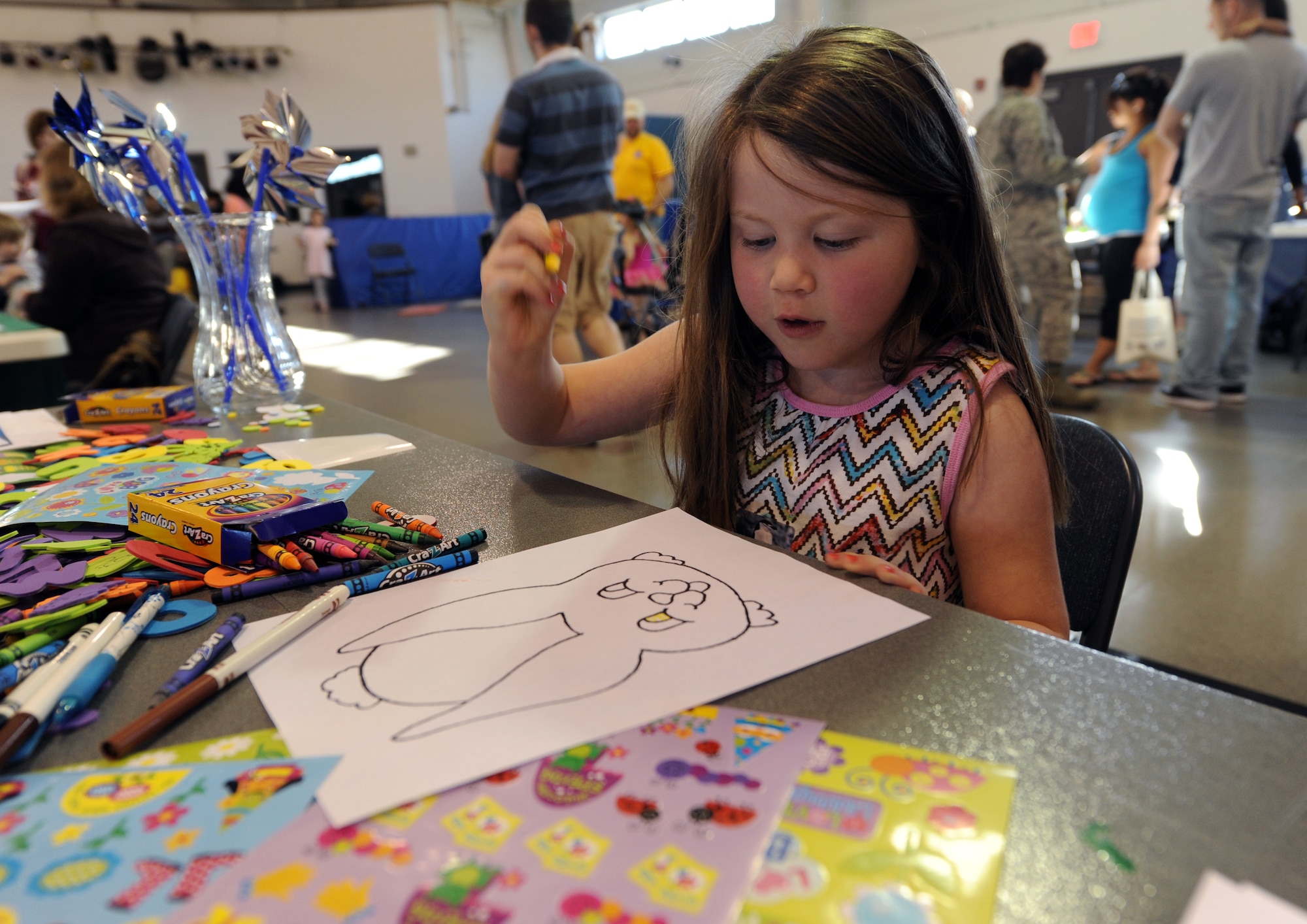Grace Davern, 5, colors an Easter Bunny during the Beautiful Child Photo Shoot and Activity Fair on April 3, 2012, on Grand Forks Air Force Base, N.D. (U.S. Air Force photo/Tim Flack)