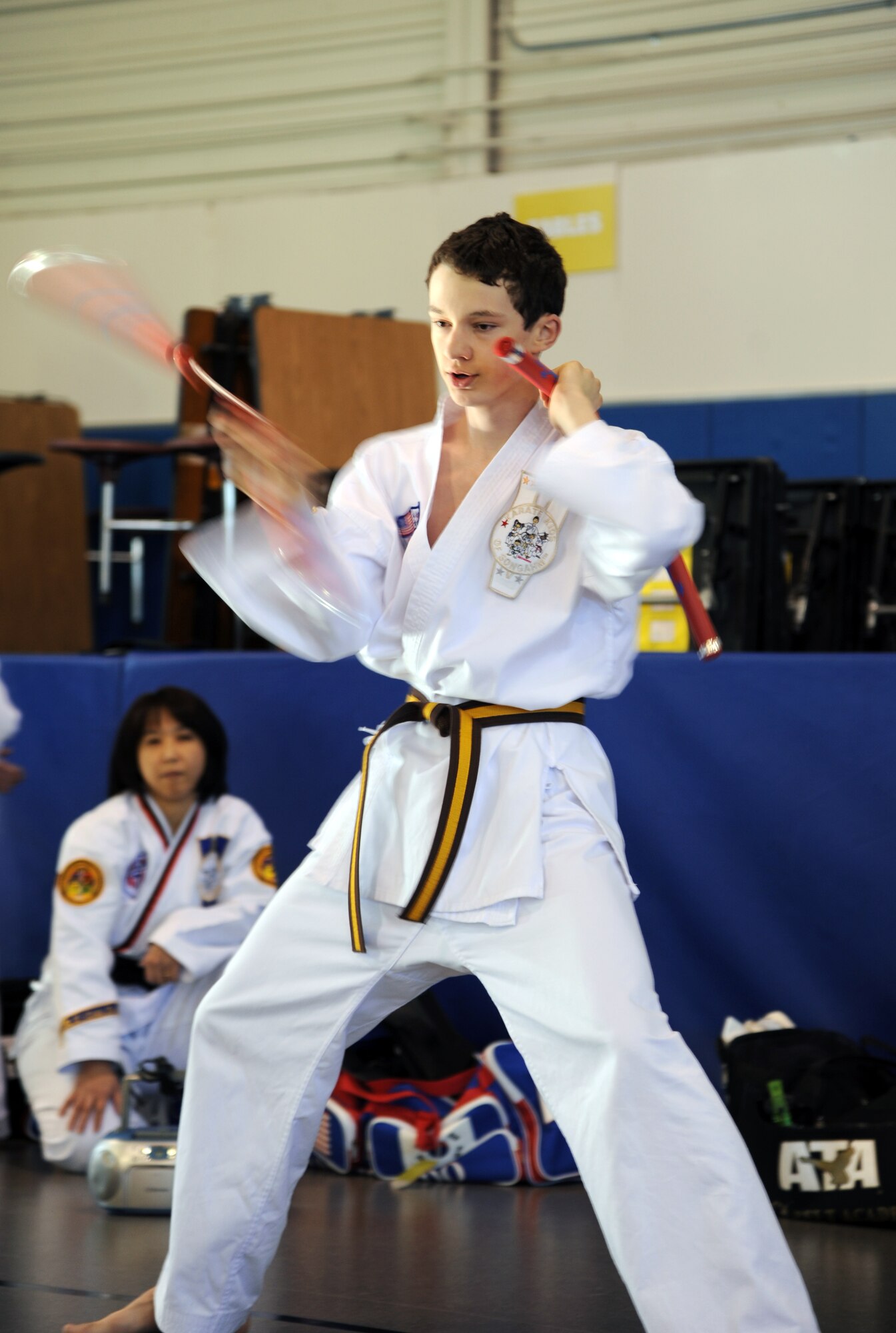 Darian Colgrove, 14, of the Ata Black Belt Academy in the city of Grand Forks, N.D., puts on a martial arts demonstration during the Beautiful Child Photo Shoot and Activity Fair on April 3, 2012, on Grand Forks Air Force Base, N.D. (U.S. Air Force photo/Tim Flack)