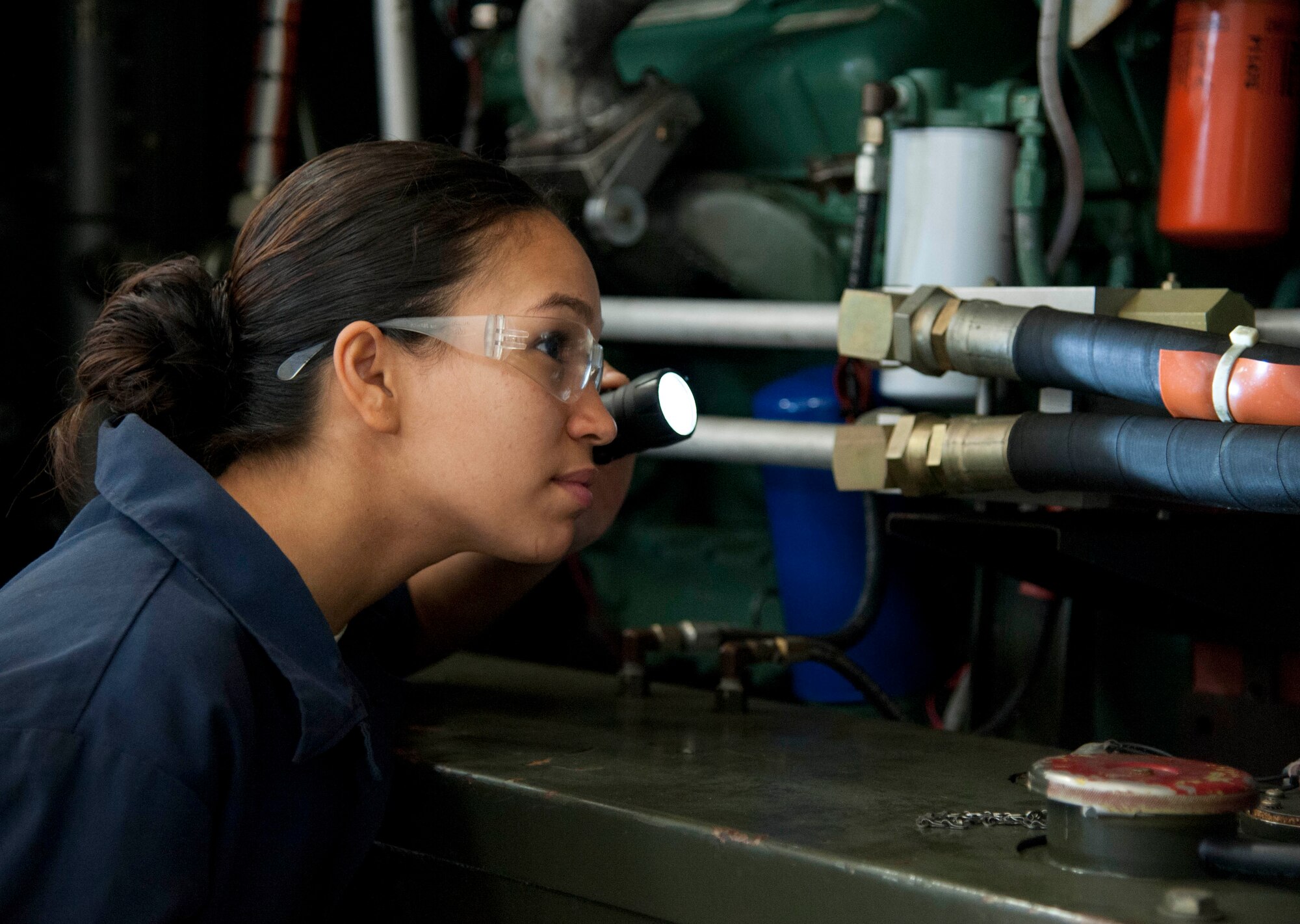 Senior Airmen Caterina Andino, 60th Maintenance Squadron aerospace ground equipment journeyman, checks a hydaulic test stand for any foreign objects Tuesday that could cause harm equpment of aircraft. (U.S. Air Force photo/Airman 1st Class Nicole Leidholm)