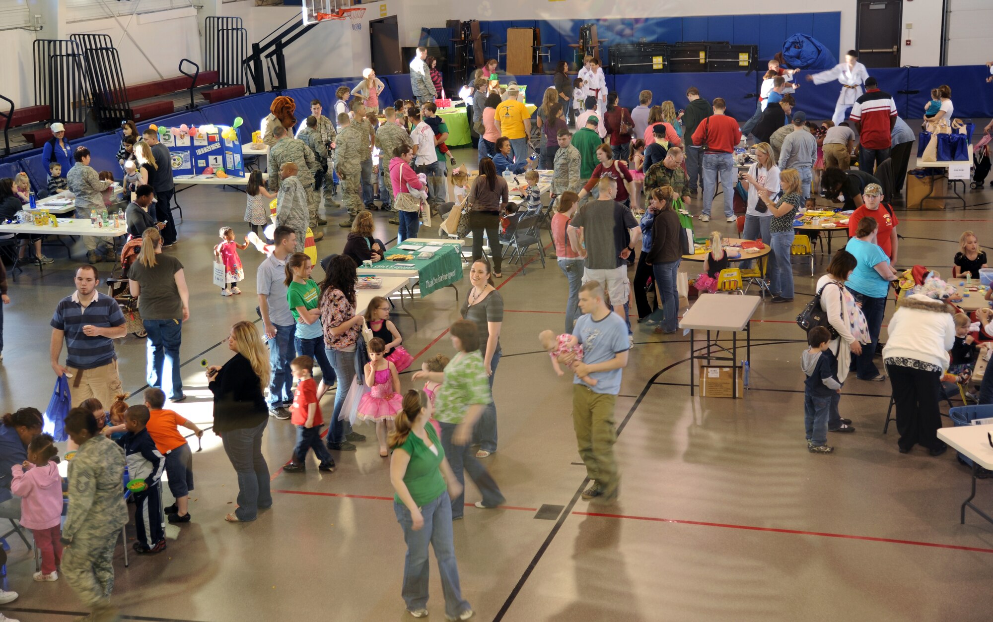 Visitors crowd Liberty Square on Grand Forks Air Force Base, N.D., for the Beautiful Child Photo Shoot and Activity Fair on April 3, 2012. (U.S. Air Force photo/Tim Flack)