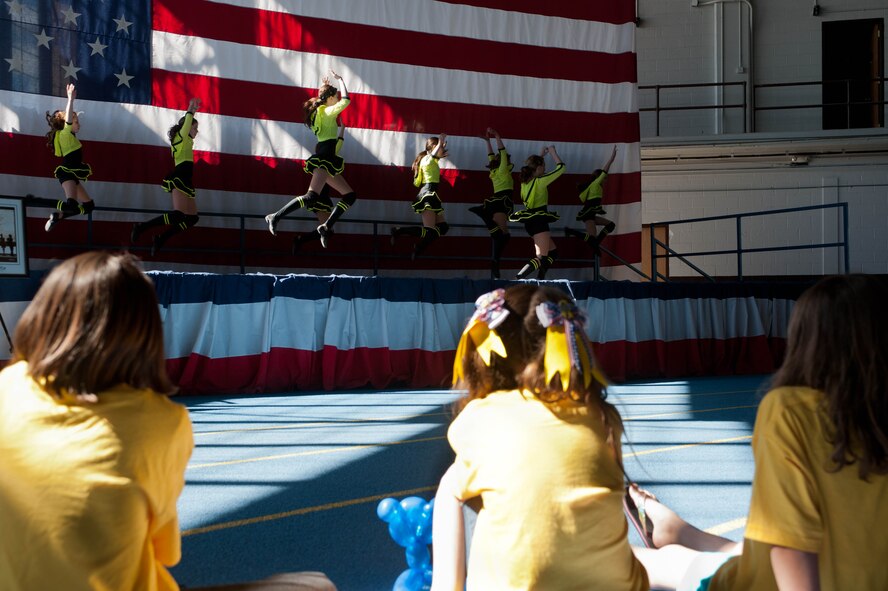 Members of the Academy of Dance Arts, perform on stage for children during the Month of the Military Child block party at Ellsworth Air Force Base, S.D., March 31, 2012. The Month of the Military Child is an opportunity to recognize military children and youth for their courage and character during deployments, frequent moves, changing schools, saying goodbye to friends and other challenges of military life. (U.S. Air Force photo by Airman 1st Class Zachary Hada/Released)