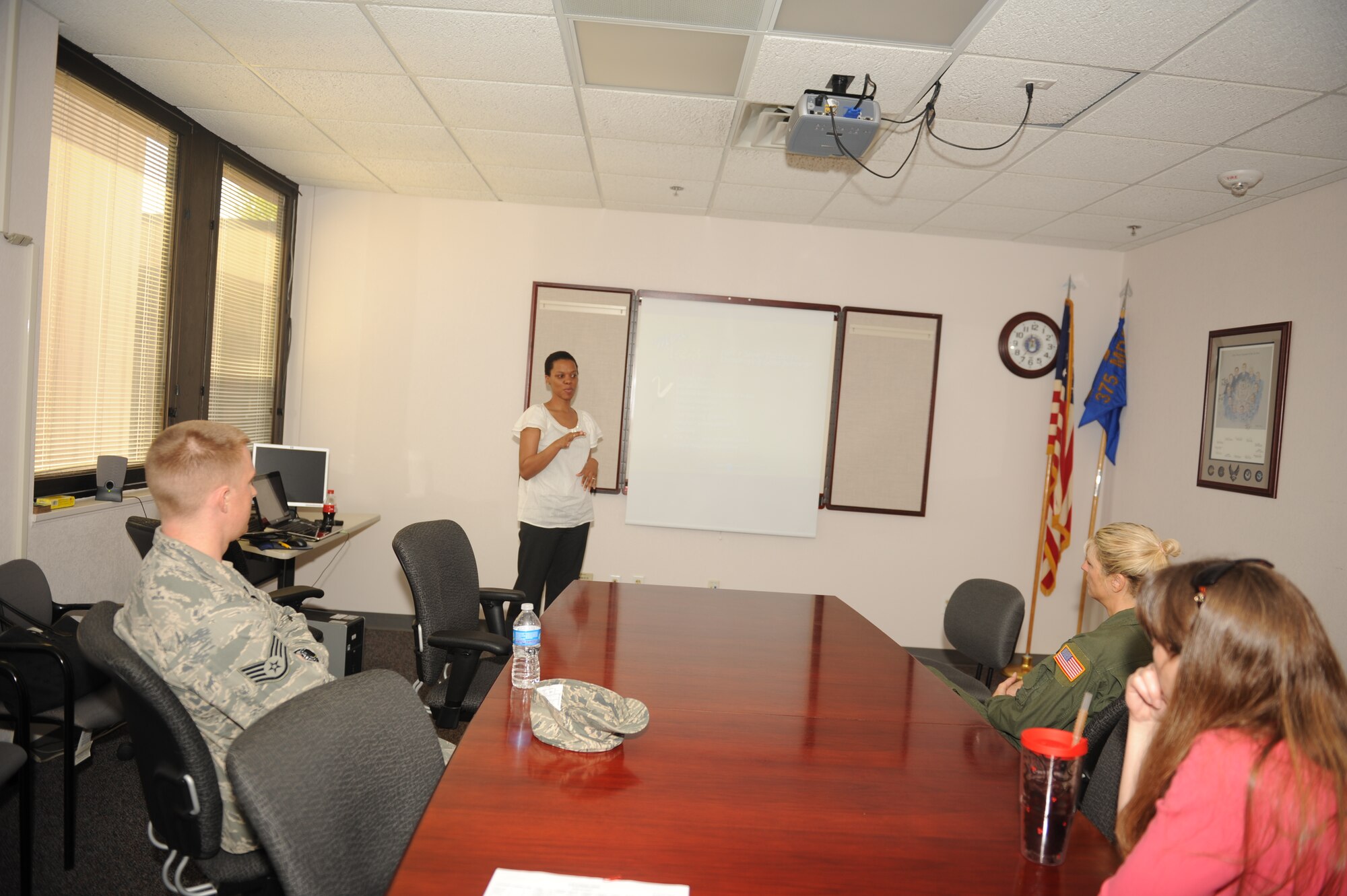 Terese Brooks, Family Advocacy Resiliency Element Red Cross volunteer, facilitates the showing of “1-2-3 Magic Parenting” videos by Dr. Phelan at the Aeromedical Staging Facility conference room. The video attempts to help parents solve problems in three steps. (U.S. Air Force photo by Senior Airman Amber R. Kelly-Herard) 
