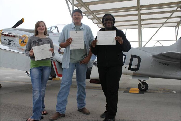 From left to right, Carrie Williams, Quentin Burgess and Faith Thomas pose with their selection certificates for the People to People student ambassador program. The three students will travel to Australia this summer as part of a cultural exchange program, having been nominated by their teachers for academic achievements, citizenship and leadership abilities. (Courtesy photo)