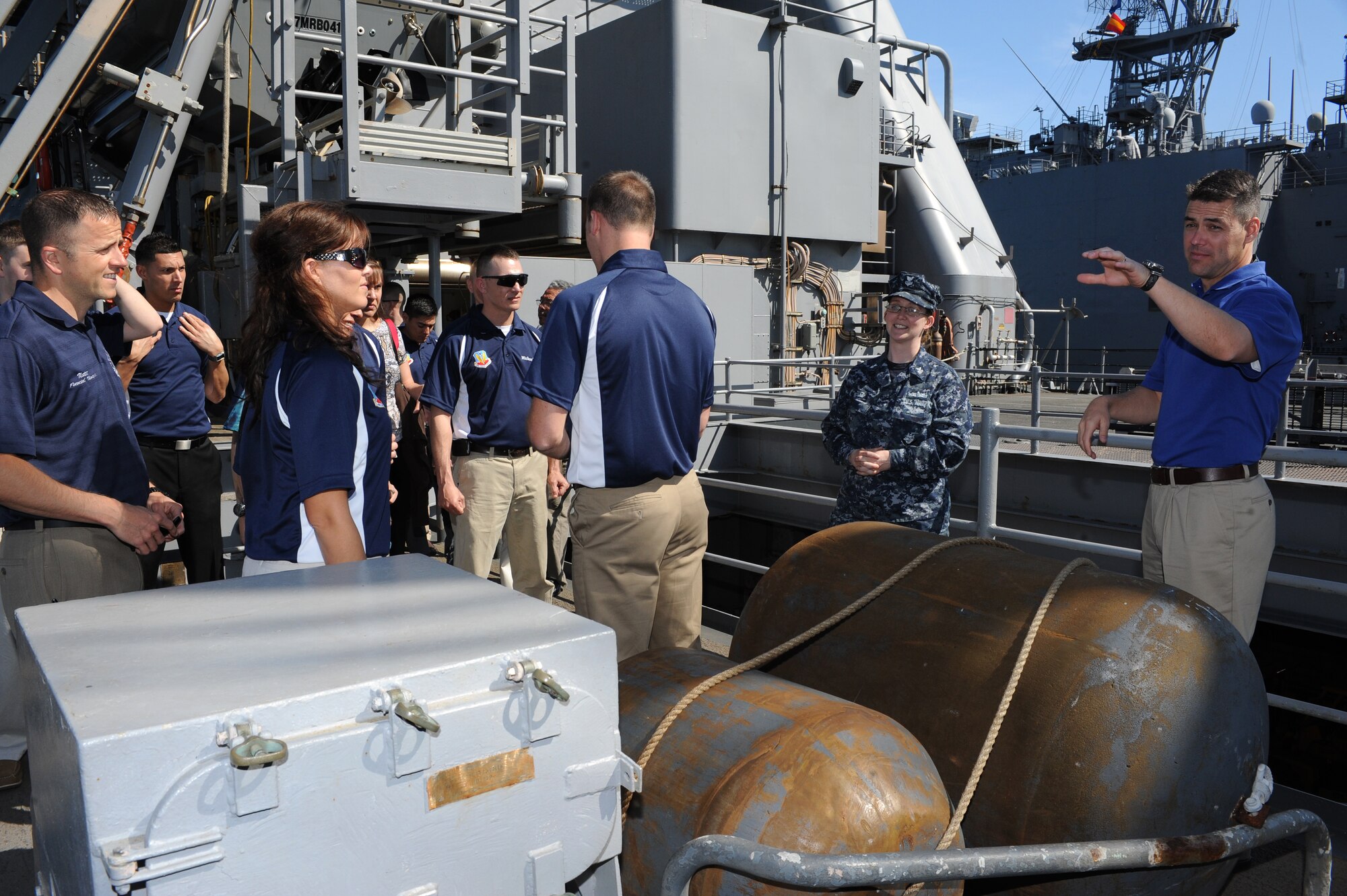 U.S. Navy Petty Officer 1st Class Cynthia Cruz, U.S.S. Oak Hill culinary specialist, gives the 2012 Air Combat Command Outstanding Airmen of the Year nominees a tour of the cargo ship at Joint Expeditionary Base Little Creek – Fort Story, Va., April 3, 2012. Nominees and their guests attended the 3-day professional development seminar as part of the 2012 ACC OAY Conference at Langley Air Force Base, Va. (U.S. Air Force photo by Airman 1st Class Teresa Cleveland/Released)