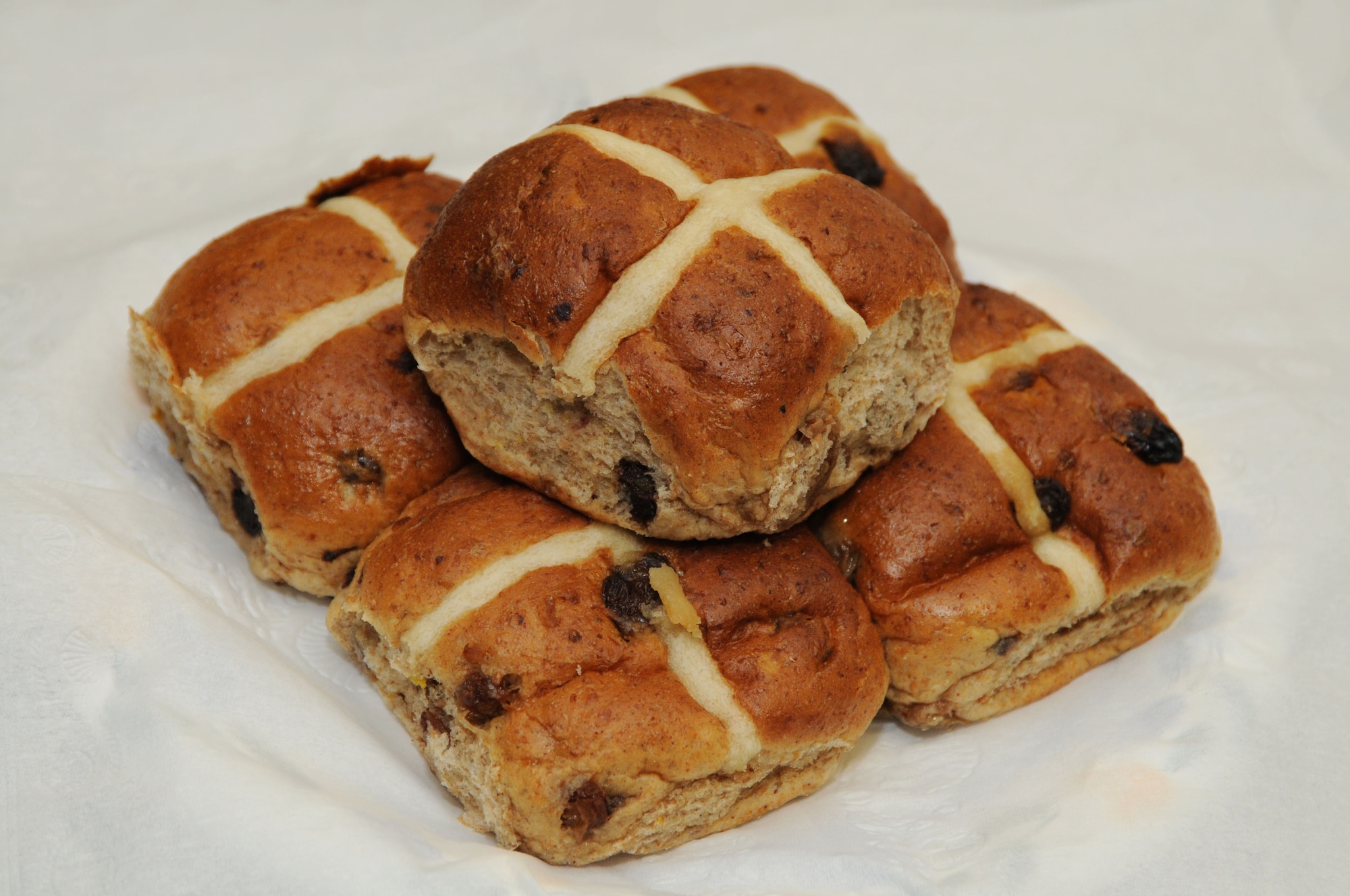 Hot cross buns are a quintessentially British tradition at Easter.They can be eaten warm or split, toasted with butter for breakfast, tea or a snack. No one knows for certain when the tradition began, but in 16th century England, bakers were limited by law to occasions when these special doughs could be made. Good Friday was one; ‘cross buns’ marked this holy day towards the end of the Lenten fast. (U.S.Air Force photo by Senior Airmen Lausanne Morgan) 
