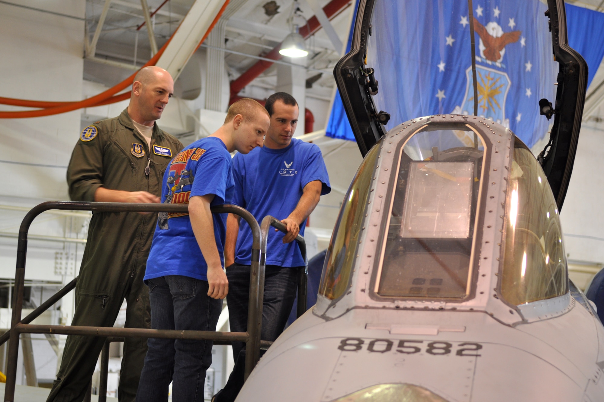 Maj. LaRue Russell, an A-10 Thunderbolt II pilot assigned to the 47th Fighter Squadron, gives Cadet 3rd Class Joshua Ayrton and Cadet 4th Class Brayden Decker a closer look at the cockpit of an A-10 during their visit to Barksdale Air Force Base, La., March 31, 2012. The two cadets were part of a group from the AFROTC Detachment, 305th Airpower Group, Louisiana Tech University, who visited Barksdale to get a look at one of their possible futures. (U.S. Air Force photo by Master Sgt. Jeff Walston/Released) 
