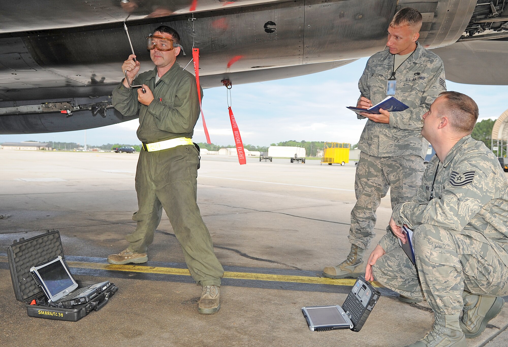 U.S. Air Force Tech. Sgt. Charles Ewing and Staff Sgt. Anthony Gillespie observe Senior Airman Thomas Neal as he removes a panel from an F-15E Strike Eagle on Seymour Johnson Air Force Base, N.C., April 4, 2012. The   quality assurance flight inspects, validates and assesses aircraft and equipment maintenance to ensure all tasks are completed to meet Air Force instructions. Ewing and Gillespie, 4th Maintenance Operations Squadron quality assurance inspectors, hail from Trinity, Ala. and Chapel, N.C. Neal, 336th Aircraft Maintenance Unit crew chief, hails from Canton, N.C. (U.S. Air Force photo/Senior Airman Gino Reyes/Released)