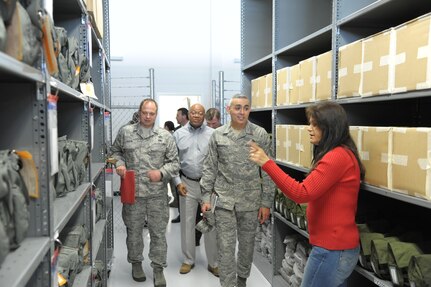 Bernadette Cline, 902nd Mission Support Group Deployment Processing Center equipment supervisor, shows deployment equipment to 502nd Air Base Wing Command Chief Master Sergeant Jose A. LugoSantiago, during his visit of the centerApril 3.  CMSgt LugoSantiago toured several 902nd MSG organizations during his visit.
(U.S. Air Force photo/ by Joel Martinez)