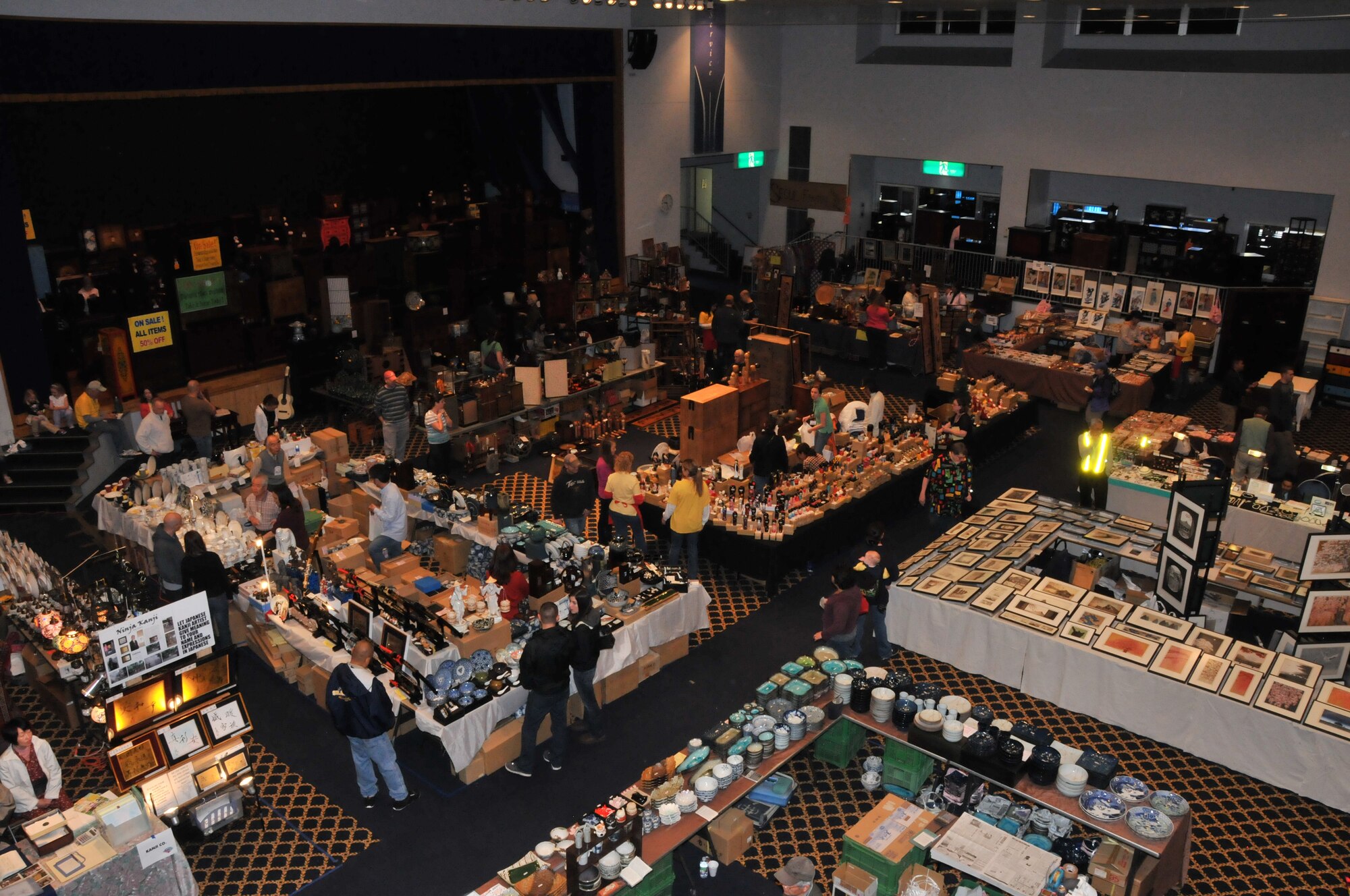 YOKOTA AIR BASE, Japan -- Vendors sell a variety of gifts at the Yokota Officer's Spouse's Club Asian Bazaar, March 31, 2012, at the Taiyo Community Center on Yokota Air Base, Japan.  Profits from the bazaar are given back to the Yokota community through scholarships and various community support programs. (U.S. Air Force photo/Airman 1st Class Desiree Economides)
