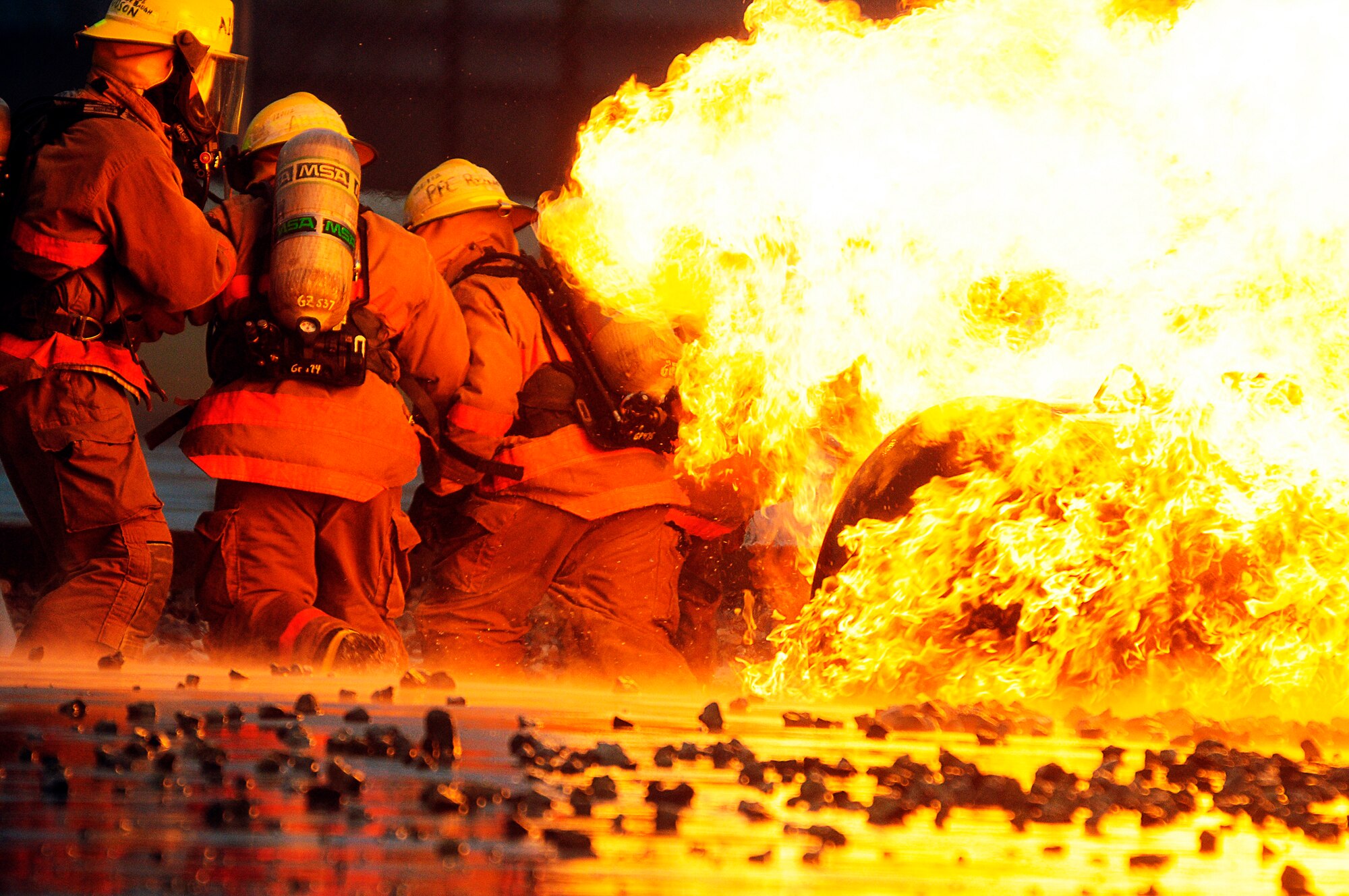 GOODFELLOW AIR FORCE BASE, Texas -- Students from the Louis F. Garland DOD Fire Academy learn how to fight fire March 16. The school trains 2200 students a year from all branches of the services and DOD civilians. (U.S. Air Force photo/ Staff Sgt. Austin Knox)