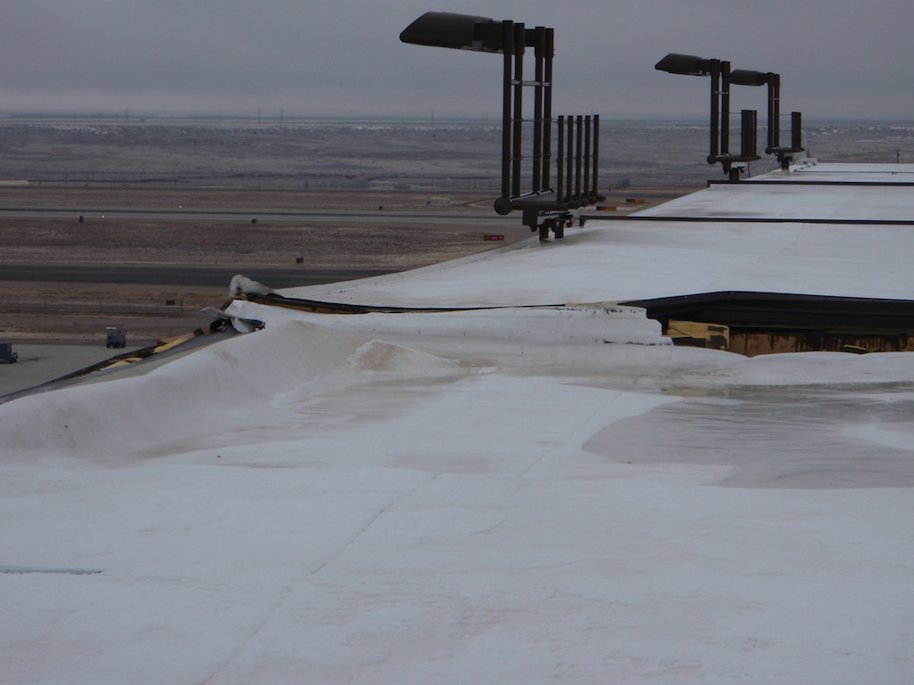 KIRTLAND AIR FORCE BASE, N.M., -- One of the roofs damagaged by strong winds in December 2011.     