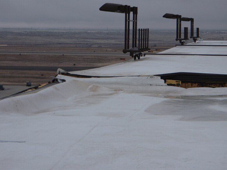 KIRTLAND AIR FORCE BASE, N.M., -- One of the roofs damagaged by strong winds in December 2011.     