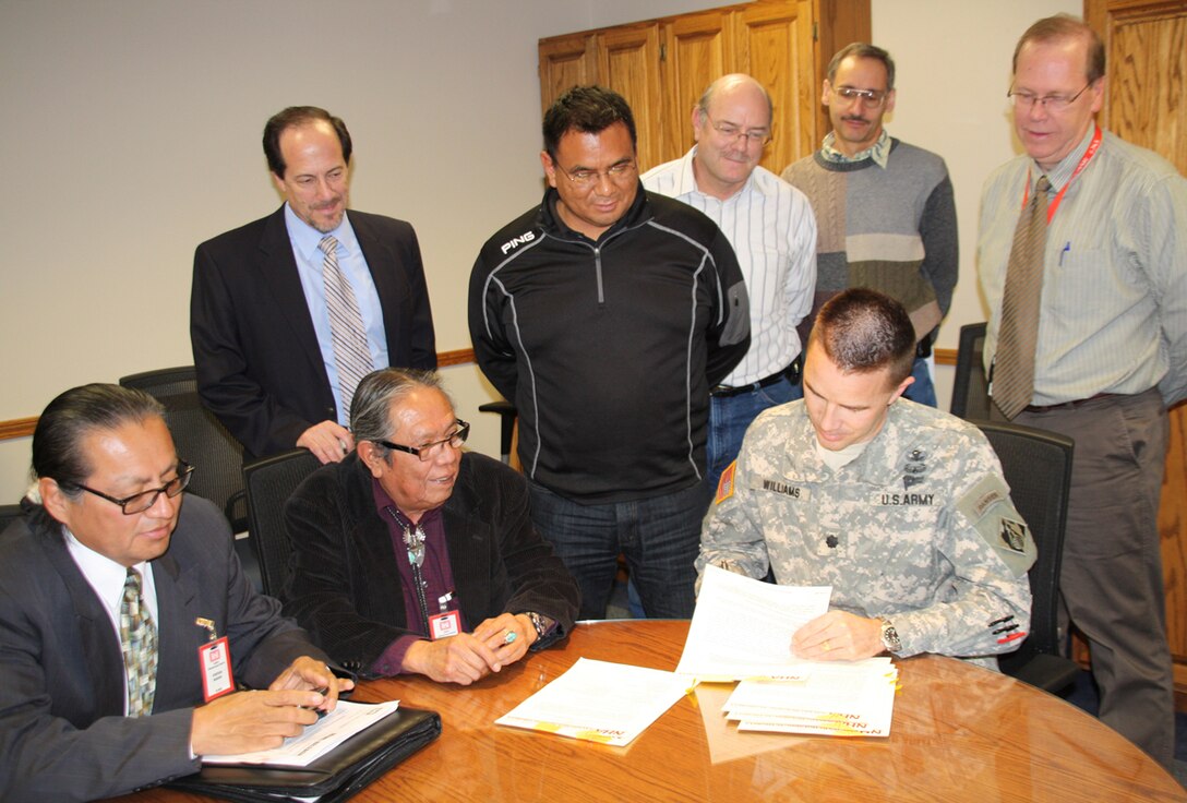 ALBUQUERQUE, N.M., -- District employees observe as Navajo Nation Housing Authority representatives (bottom row center) Senior Development Coordinator Earl Tulley and (left) Survey Manager Michael Paisano witness the signing of the MOA by District Commander Lt. Col. Jason Williams.