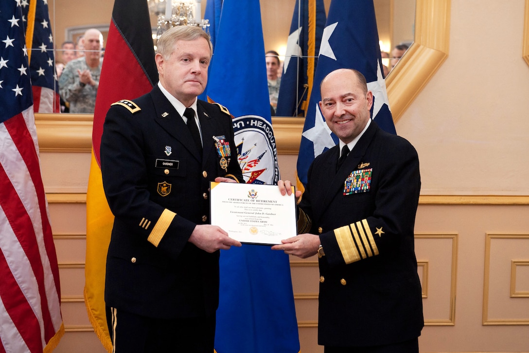U.S. Navy Adm. James G. Stavridis, commander of U.S. European Command and NATO supreme allied commander, Europe, presents the certificate of retirement to U.S. Army Lt. Gen. John D. Gardner during a ceremony in Patch Barracks in Stuttgart, Germany, April 2, 2012. Gardner, the former deputy commander U.S. European Command, retired after 36 years of service in the Army.
