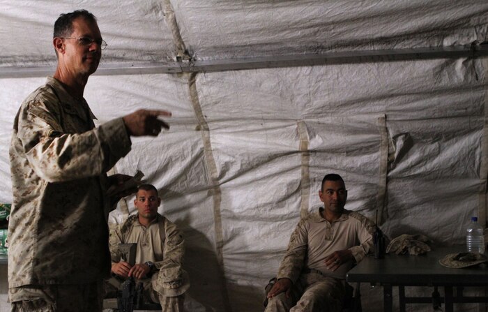 U.S. Navy Lt. Edward H. Erwin, the 2nd Battalion, 9th Marine Regiment chaplain, gives an early Easter service to Marines here April 4, 2012. Erwin traveled to different outposts and patrol bases around Helmand province’s Marjah district to offer Easter services to those who wouldn’t be near a chapel on Easter Sunday.