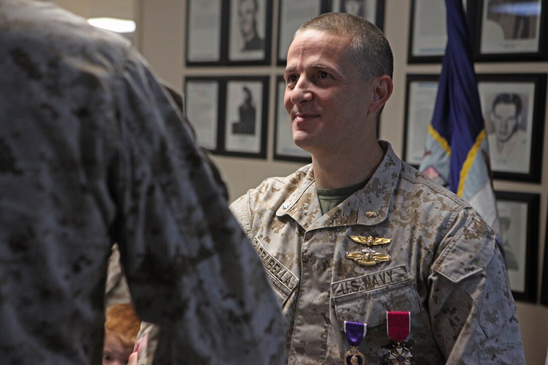 Birdsboro, Pa., native Cmdr. Sean Barbabella, the recent division surgeon for 2nd Marine Division (Forward), shakes hands with Marines and sailors who attended his Legion of Merit presentation ceremony April 5.  Barbabella received the Legion of Merit, one of the military’s highest awards, for his accomplishments during a yearlong deployment to Afghanistan.  Barbabella was responsible for restructuring the patient tracking system in Helmand province, Afghanistan.