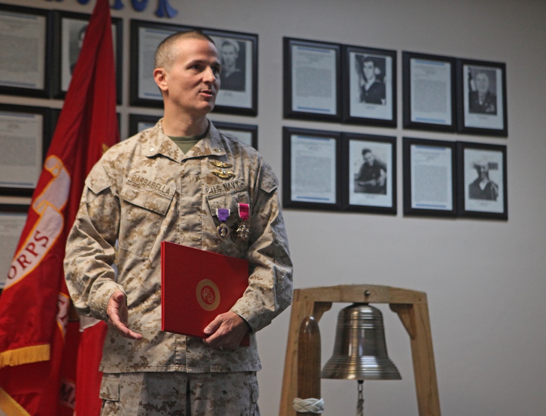 Birdsboro, Pa., native Cmdr. Sean Barbabella speaks to a group of Marines and sailors during his award ceremony April 5.  Barbabella received the Legion of Merit, one of the military’s highest decorations, for his exemplary actions as the 2nd Marine Division (Forward) division surgeon during a recent yearlong deployment.  Barbabella was credited with restructuring the patient tracking system, developing a system of tracking concussion injuries, and mentoring medical specialists with the Afghan National Army’s 215th Corps.