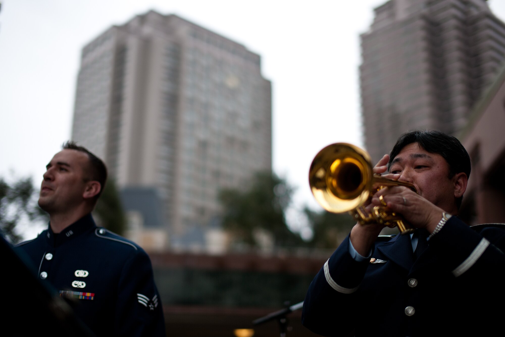 EBISU GARDEN PLACE, Japan -- One of the Japan Air Self-Defense Forces trumpet players plays along side SrA William Pressgrove, Band of the Pacific Asia vocalist, at the Cherry Blossom Centennial opening, Ebisu Garden Place, Tokyo, Japan, Mar. 31, 2012. "The joint performance symbolizes the Japan-U.S. friendship," stated Mr. Masato Yagi, Band of the Pacific-Asia community relations specialist. (U.S. Air Force photo/Staff Sgt. Josh Voyles)