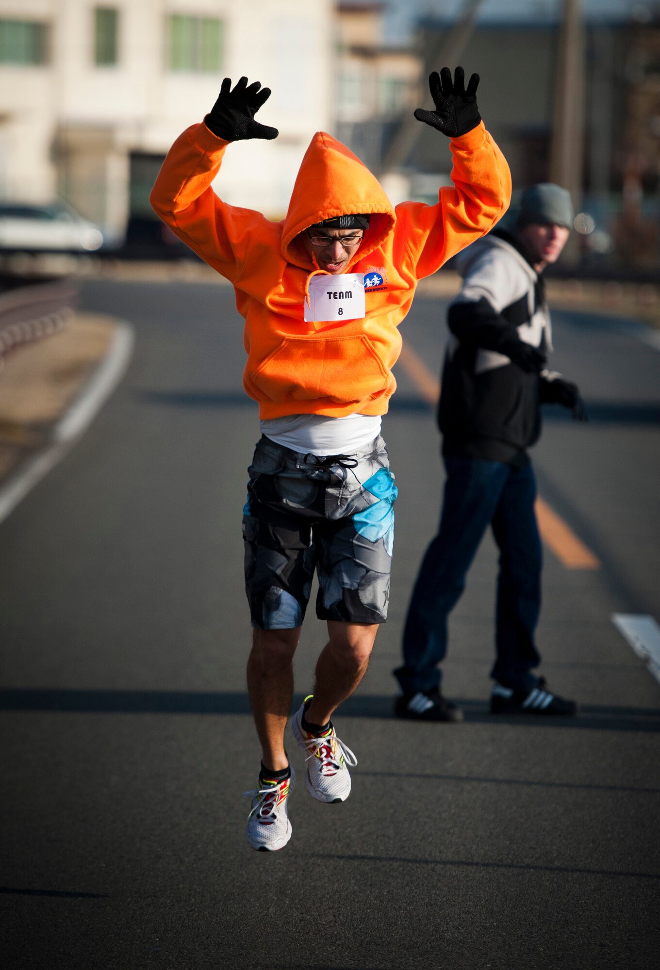 YOKOTA AIR BASE, Japan -- An entrant performs "burpees" during a 5K relay race at Yokota Air Base, Japan, April 2, 2012. The 374th Airlift Wing sexual assault response coordination office held the 5K relay race to kick off Sexual Assault Awareness Month. (U.S. Air Force photo/Staff Sgt. Samuel Morse)