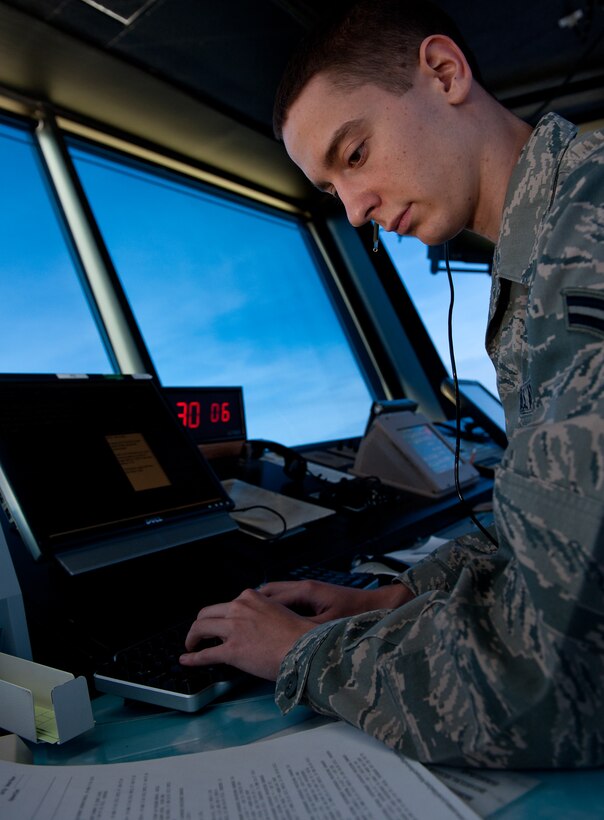 Airman 1st Class Austin Layton, 28th Operations Support Squadron air traffic controller, inputs data into the airfield automation system in the ATC tower on Ellsworth Air Force Base, S.D. April 3, 2012. This system allows ATC Airmen to efficiently access data vital to safe aircraft activity. (U.S. Air Force photo by Airman 1st Class Kate Thornton/Released)