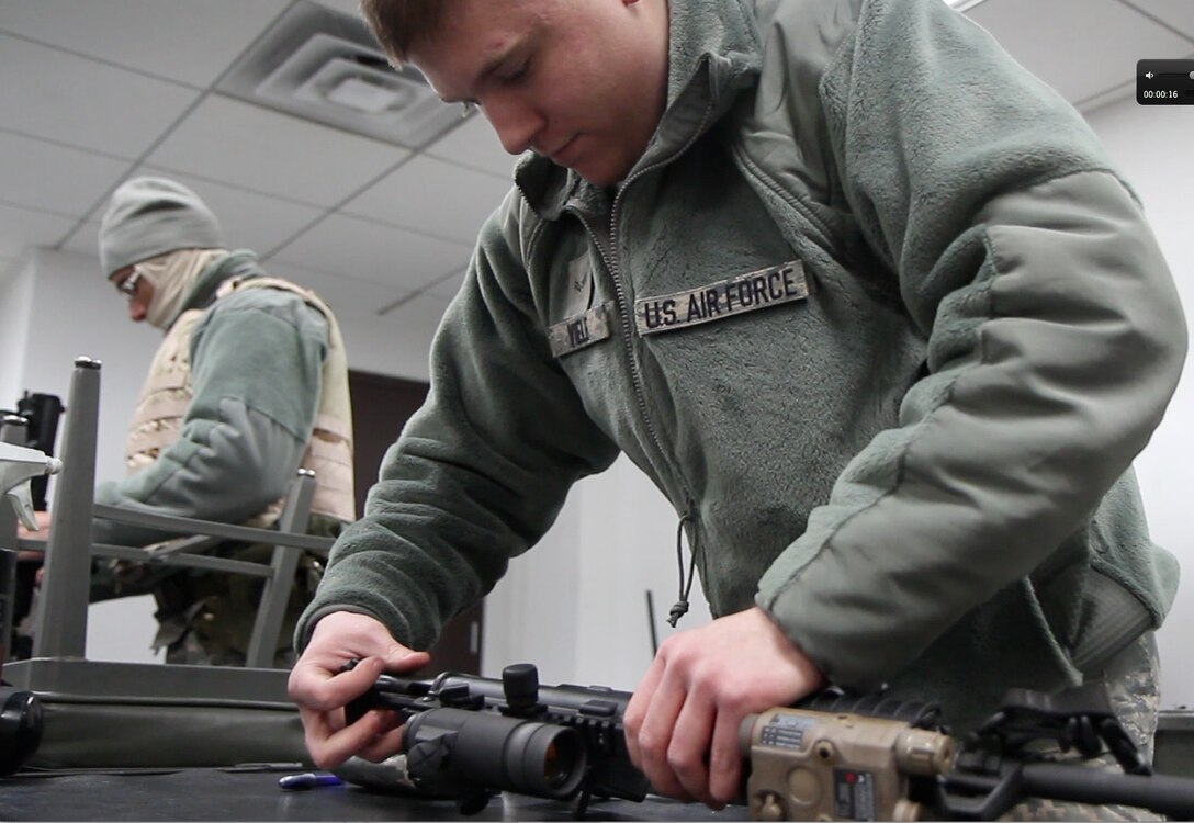 Airman First Class Fred Viele cleans his M-4 following a live fire session at the base target range. Viele is a reservist and is assigned to the 932nd SFS at Scott Air Force Base.  (U.S. Air Force photo/Tech. Sgt. Christopher Parr)