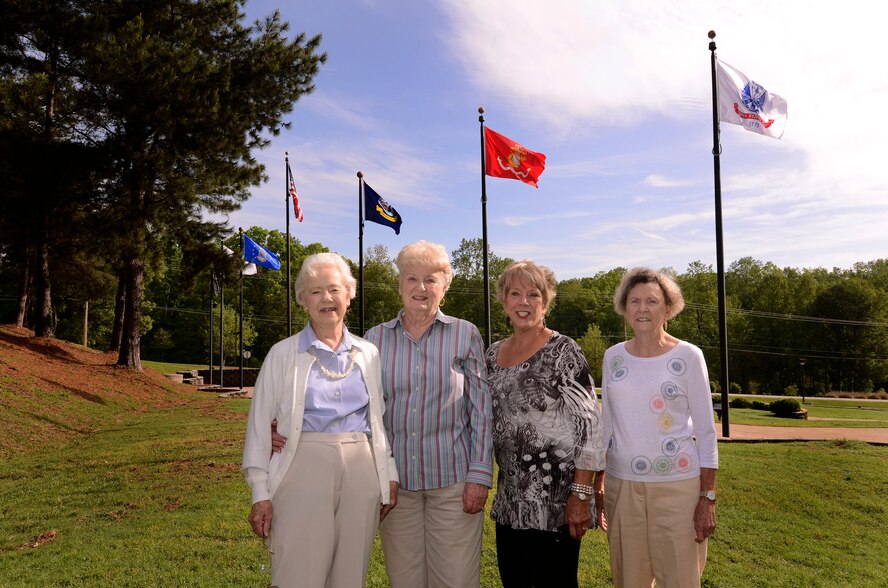 Val Barton, Nancy Black, Jan Tamer and Vonnell Adsit, Dobbins Thrift Store volunteers, recently replaced the flags at the base POW/MIA Memorial Park with funds raised from sales of donated thrift store mercandise. The Dobbins Thrift Store, established 28 years ago, is open every Thursday and Unit Training Assembly (UTA) Saturday, 10 a.m. to 3 p.m. Proceeds from sales fund various base projects. (U.S. Air Force photo/Brad Fallin)