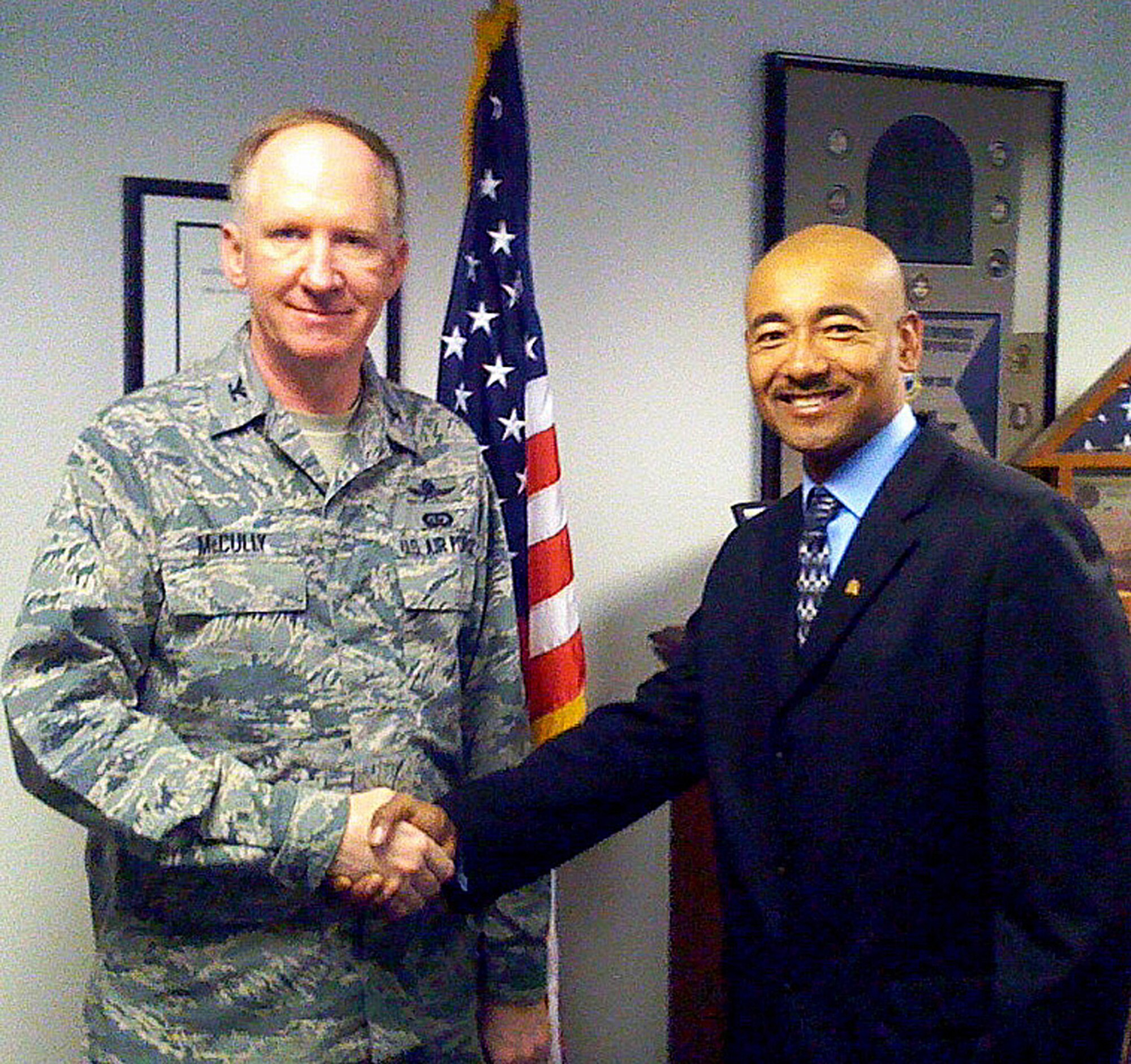 TRAVIS AIR FORCE BASE, Calif. -- On a recent visit to Travis, Col. Michael McCully, Air Force Reserve Command A7, swore in Capt. Otha Livingston, a new captain, to the 349th Air Mobility Wing. (Courtesy photo)

