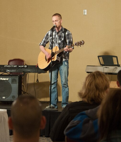 Senior Airman Christopher Randall, Air Force Financial Services Center financial technician, performs a number during Ellsworth’s Got Talent contest at Ellsworth Air Force Base, S.D., March 24, 2012. Randall played an original song that he wrote for his wife. (U.S. Air Force photo by Airman 1st Class Alystria Maurer/Released)
