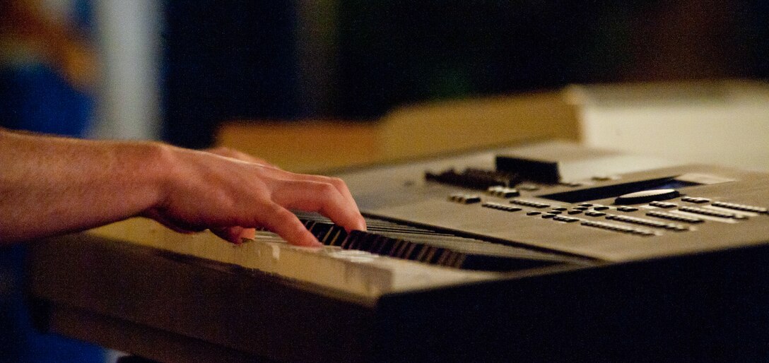 Senior Airman James Chamberlain, 28th Operations Support Squadron assistant unit deployment manager, plays a classical medley on his keyboard during Ellsworth’s Got Talent contest at Ellsworth Air Force Base, S.D., March 24, 2012. Chamberlain’s performance put him in the running to become a member of the Air Force’s premiere entertainment group Tops In Blue. (U.S. Air Force photo by Airman 1st Class Alystria Maurer/Released)