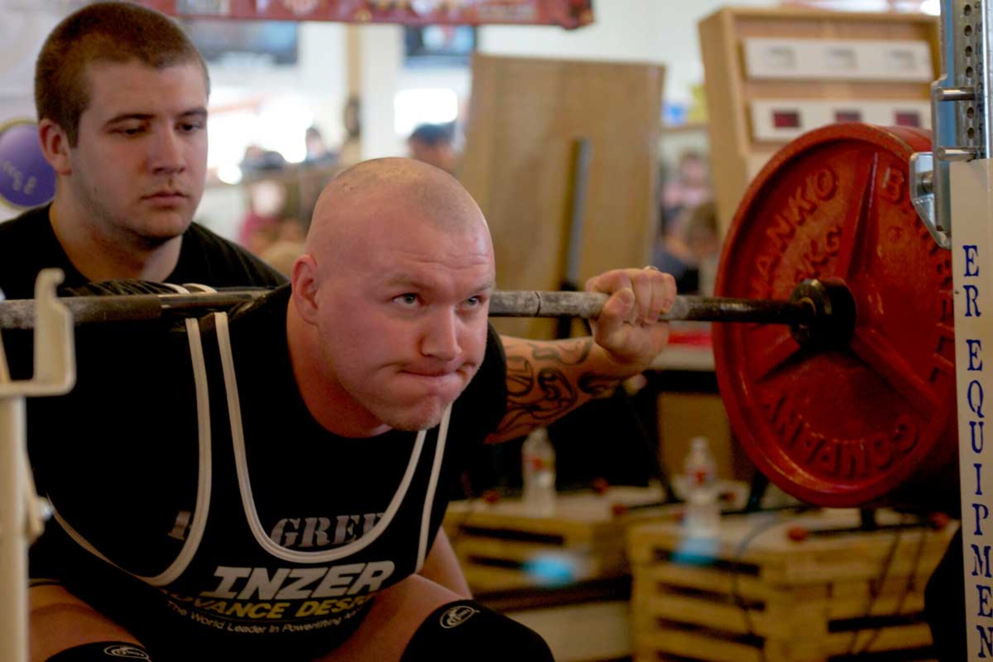 Staff Sgt. Larry Martin, a competitor representing the 49th Missile Defense Battalion, Alaska Army National Guard, maintains focus to successfully accomplish a squat lift during the Alaska State Powerlifting Championships at the Southside Strength & Fitness Center in Anchorage March 24.  Martin's best squat during the competition was nearly 419 lbs. (Alaska Army National Guard photo/ Spc. Balinda O'Neal, 134th Public Affairs Detachment)