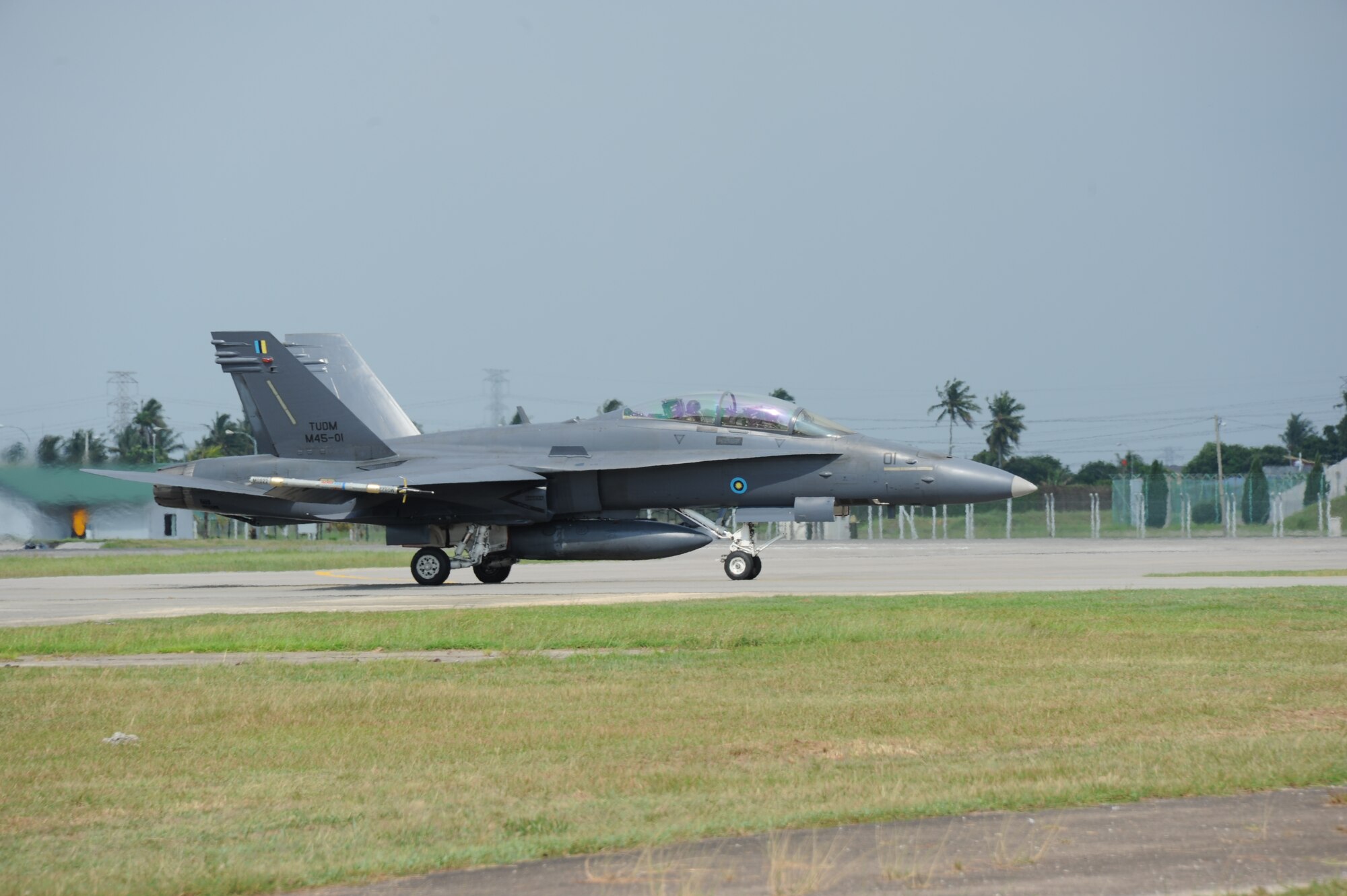 A Royal Malaysian Air Force F/A-18D taxis to the end of the runway during Cope Taufan 2012 at TUDM Butterworth in northwestern Malaysia Apr. 4, 2012. Cope Taufan, the biennial live-flying exercise between the U.S. Air Force and RMAF, includes dissimilar basic fighter maneuvers and dissimilar air combat tactics training. (U.S. Air Force photo/Master Sgt. Matt Summers/released)