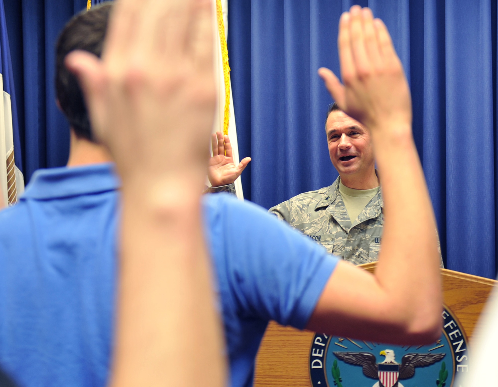 U.S. Air Force Brig Gen. Donald Bacon, 55th Wing commander swears in newly enlisted recruits at the Omaha Military Entrance Processing Station, Neb., March 27. The Omaha MEPS has enlistment responsibility for 71 counties in Nebraska and 18 counties in Iowa. (U.S. Air Force photo by Jeff Gates/Released)