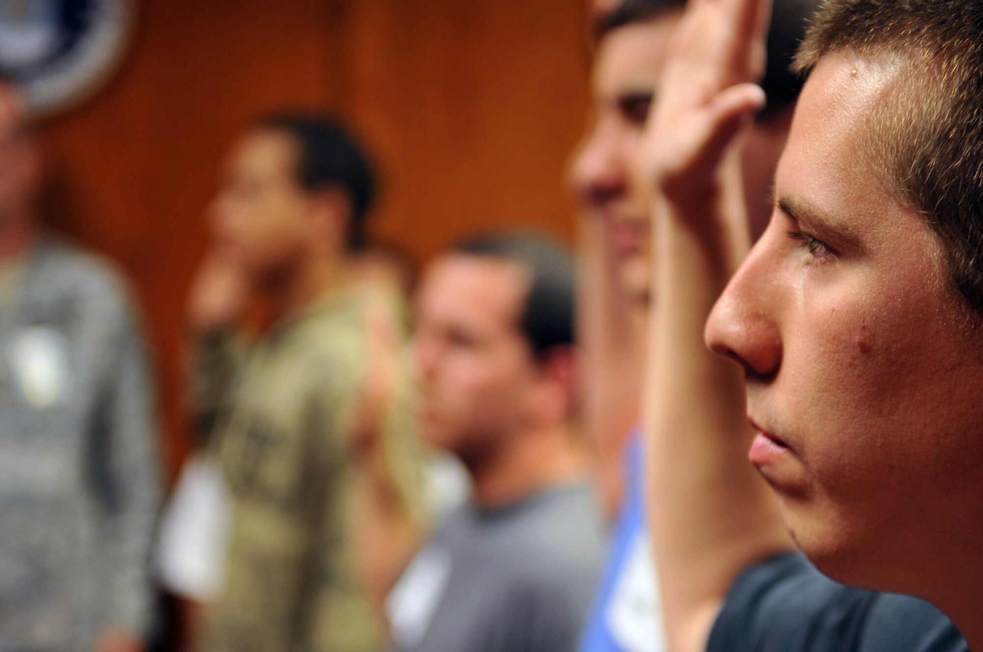 Andrew Gooch from Omaha, Neb. swears in before entering the U. S. military. U.S. Air Force Brig. Gen. Donald Bacon, 55th Wing commander, was on hand swearing in newly enlisted recruits at the Omaha Military Entrance Processing Station in Omaha Neb., March 27. The Omaha MEPS is one of a network of 65 MEPS located nationwide and in Puerto Rico. (U.S. Air Force photo by Jeff Gates/Released)