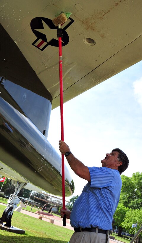 Osea McDaniel, 42nd Operations Support Flight contractor, washes pollen from a F-105D Thunderchief static display at Maxwell Air Force Base, Ala., April 4. Contractors from the 42nd OSF wash the 12 static displays on Maxwell and Gunter Annex twice a year to enhance the appearnce and prevent corrosion from forming on some of the nearly 20-year-old displays. (U.S. Air Force photo by Senior Airman Christopher Stoltz)