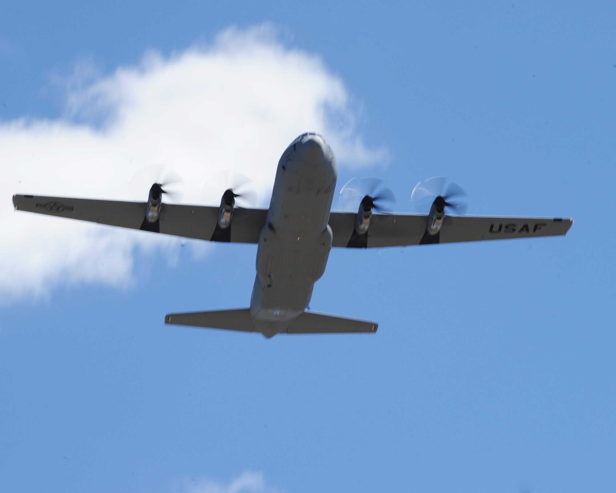 A new C-130J flies into Dyess Air Force Base, Texas, April 4, 2012. The new aircraft was delivered by Gen. Raymond Johns, Air Mobility Command commander, Scott Air Force Base, Ill. The aircraft is the 17th of 28 to be delivered to Dyess, replacing the legacy fleet of the C-130 Hercules model. (U.S. Air Force photo by Airman 1st Class Cierra Bullock)