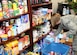 Senior Airman Amy Breeden, 11th Logistics Readiness Squadron vehicle operator, organizes food and household items March 30. The items were donated to the Andrews Attic in support of families effected by a base housing fire that occurred March 29. (U.S. Air Force photo/Senior Airman Laura Turner)