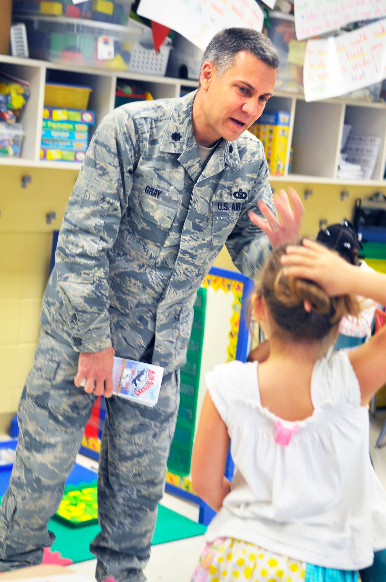 Lt. Col. Dwayne Gray, 78th Operations Support Squadron director of operations, and this year's Robins Air Show director, speaks to first grade students in Mrs. Courtney Ritter's class at Kay Road Elementary School in Byron Friday. Col Gray talked to the students about special attractions at this years open house. (U. S. Air Force photo by Sue Sapp)