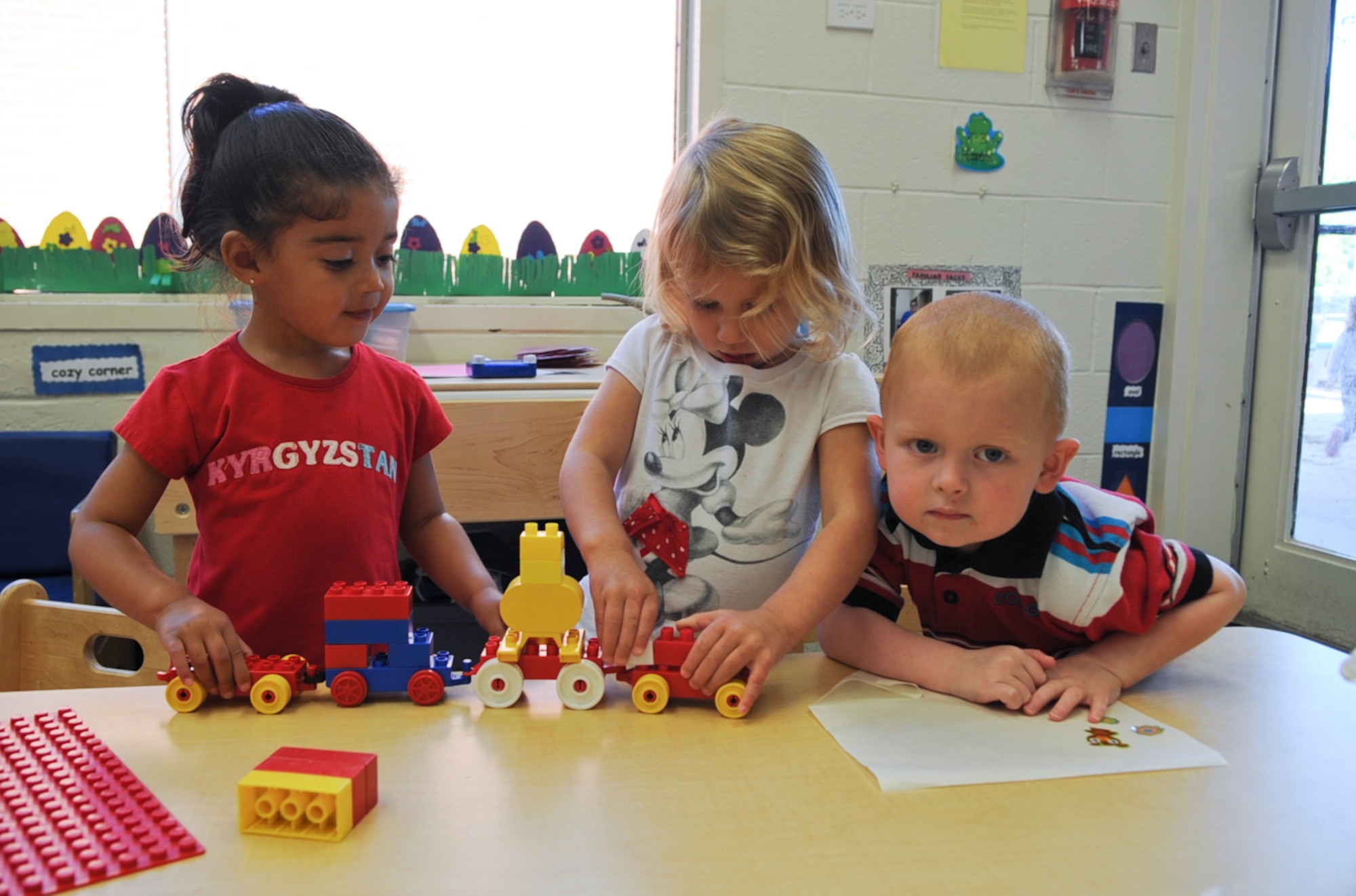 Children from a toddler class play together at the child development center on Seymour Johnson Air Force Base, N.C., April 3, 2012. Due to frequent moves many military children experience disrupted relationships with friends and must adapt to new schools. The CDC and base youth center provide a place for these children to bond with each other. (U.S. Air Force photo/Airman 1st Class Aubrey Robinson/Released)